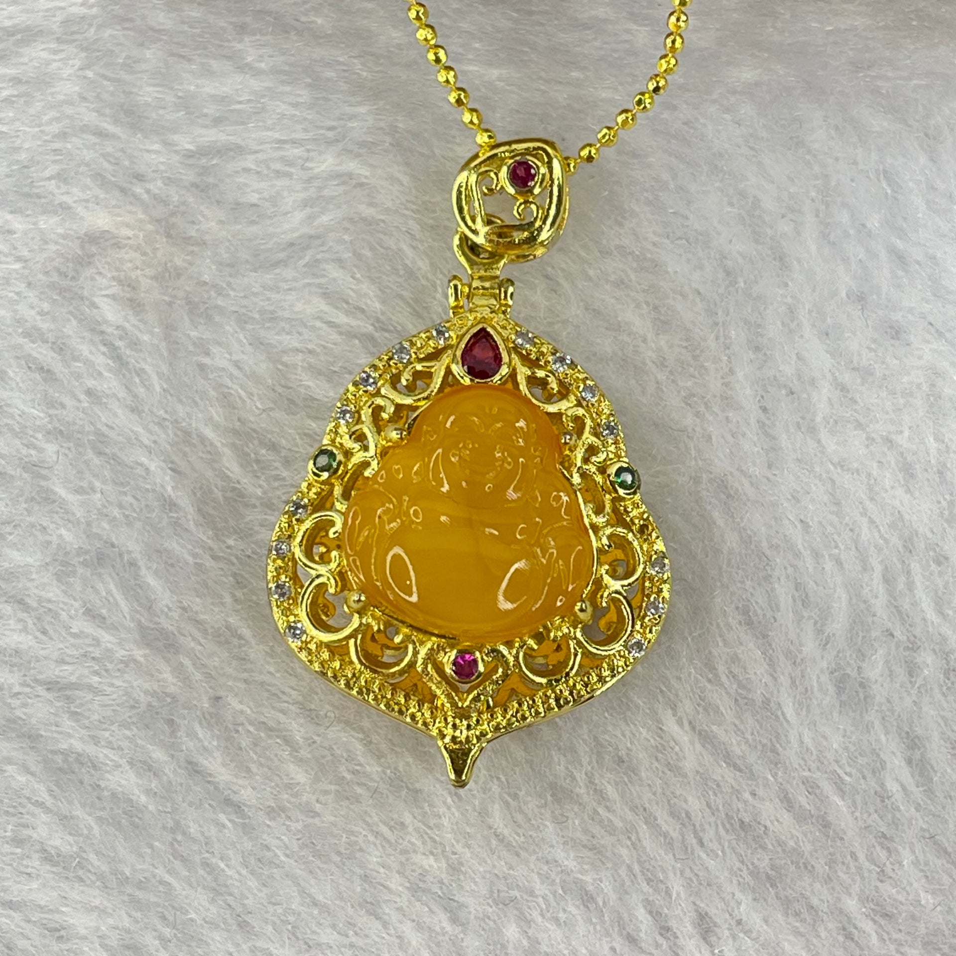 Natural Butterscotch Amber Milo Buddha with Crystals in Gold Color Necklace 5.64g 12.2 by 11.8 by 3.2mm - Huangs Jadeite and Jewelry Pte Ltd