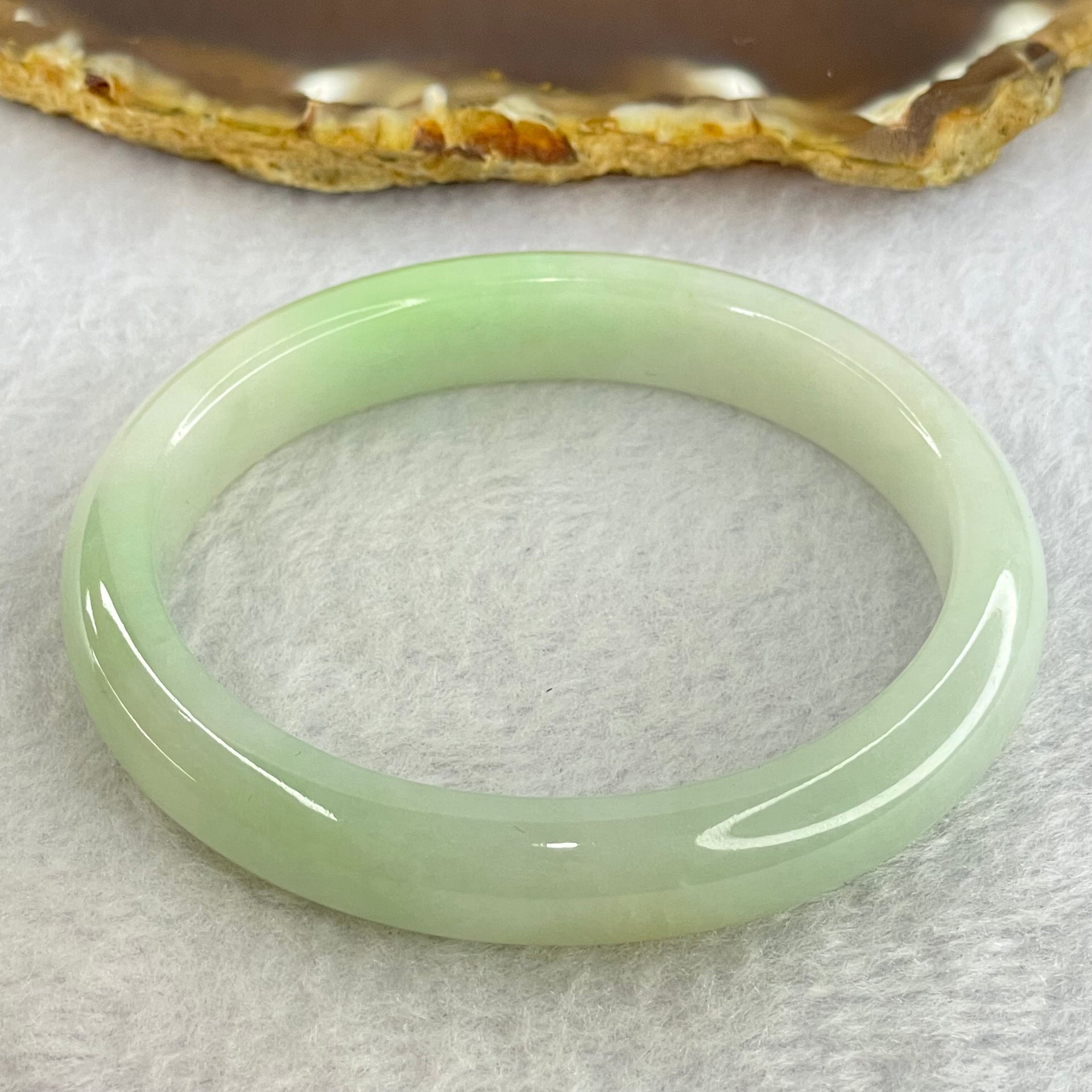 Type A Light Green Jadeite Oval Bangle Internal Diameter 56.2mm 40.54g 11.1 by 7.2mm (Slight Internal Line) - Huangs Jadeite and Jewelry Pte Ltd
