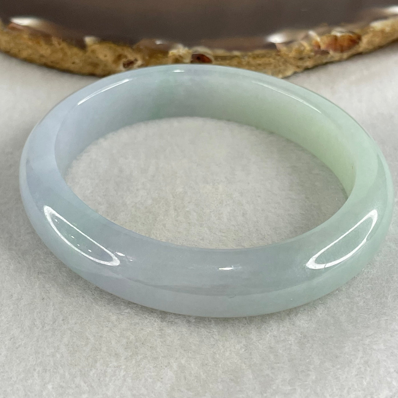 Type A Faint Green Faint Lavender Jadeite Oval Bangle 48.77g Inner Diameter 57.7mm 12.1 by 8.0mm with NGI Cert No. 32888362 (Internal Line) - Huangs Jadeite and Jewelry Pte Ltd