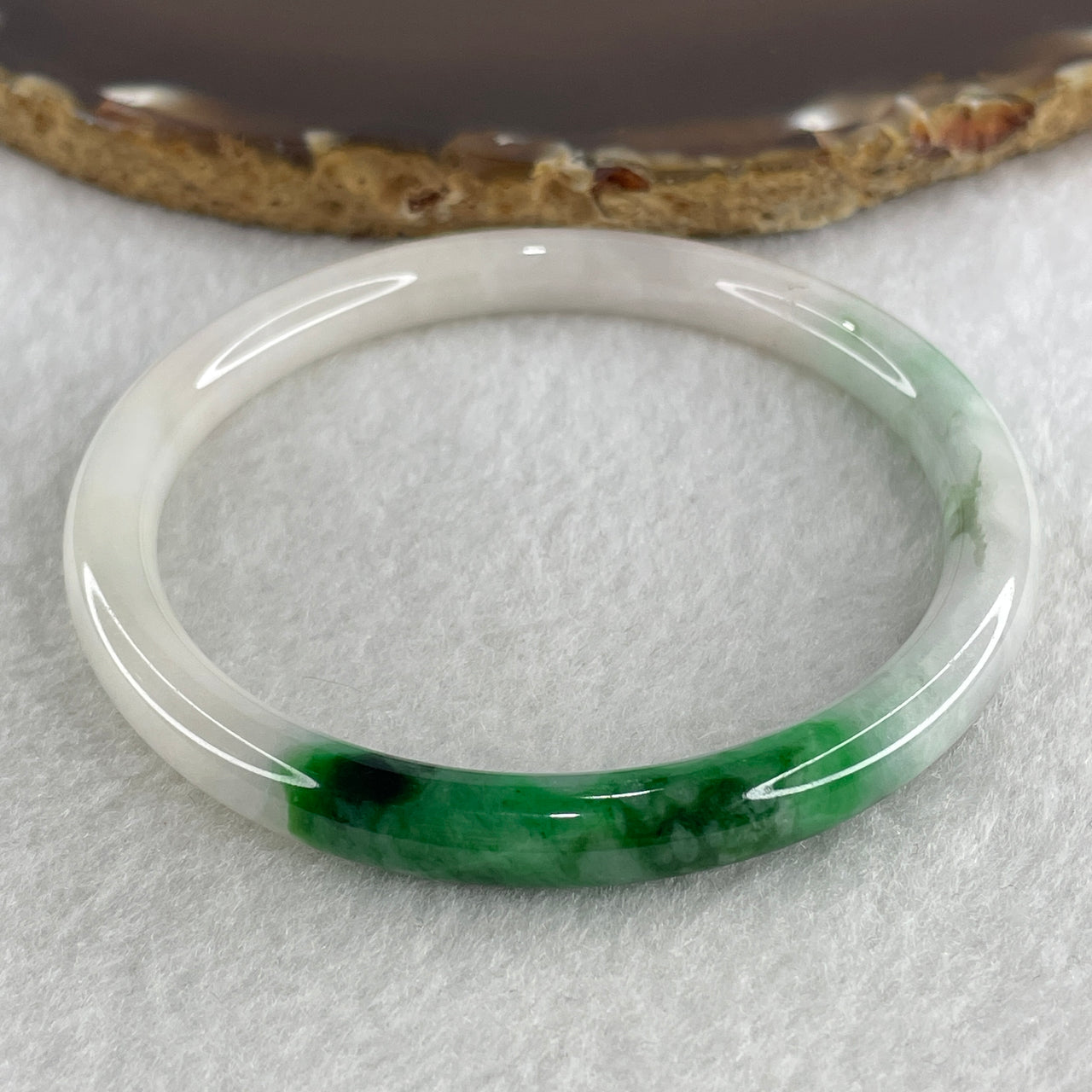 Certified Natural Type A White with Green Piao Hua Jadeite Bangle 24.62g Internal Diameter 57.5mm 7.0 by 7.6mm (Slight Internal Line)
