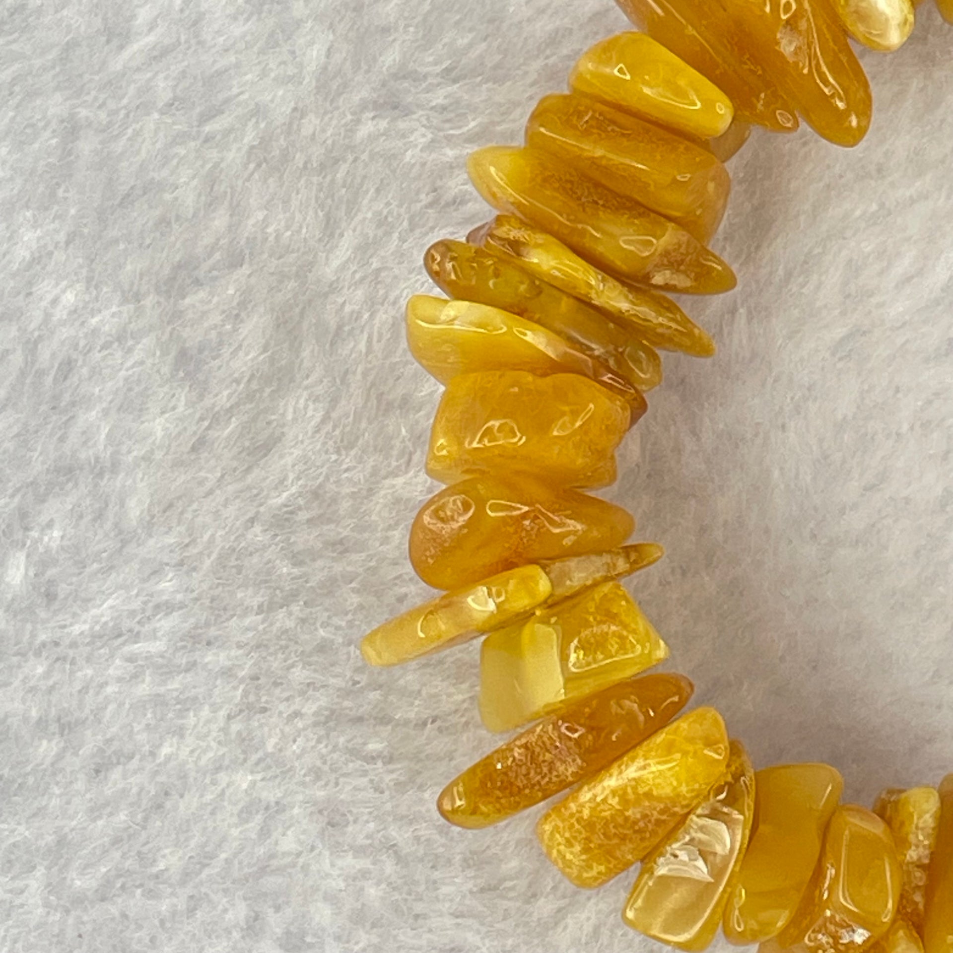 Natural Beeswax Raw Stone Irregular Beads Bracelet 天然蜜蜂蜡原石手链 22.59g 18.5cm 21.6 by 12.6 by 4.7mm, 13.1 by 11.7 by 4.8mm 54pcs - Huangs Jadeite and Jewelry Pte Ltd