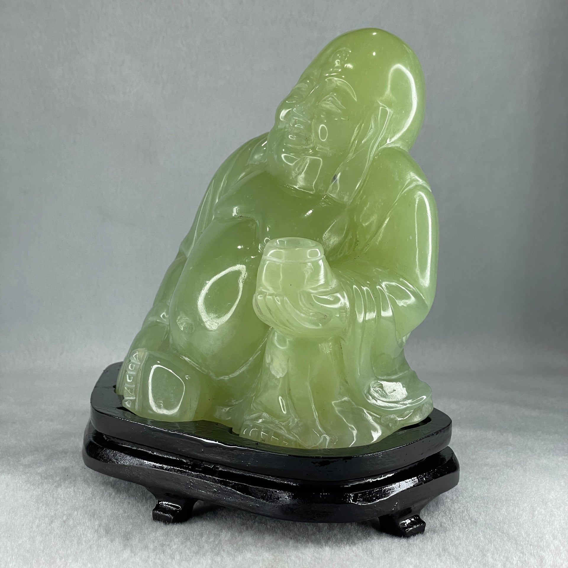 Natural Green Serpentine Siting Milo Buddha with Wealth Pot with Wooden Stand Display 1362.0g 165.0 by 110.0 by 150.0mm - Huangs Jadeite and Jewelry Pte Ltd