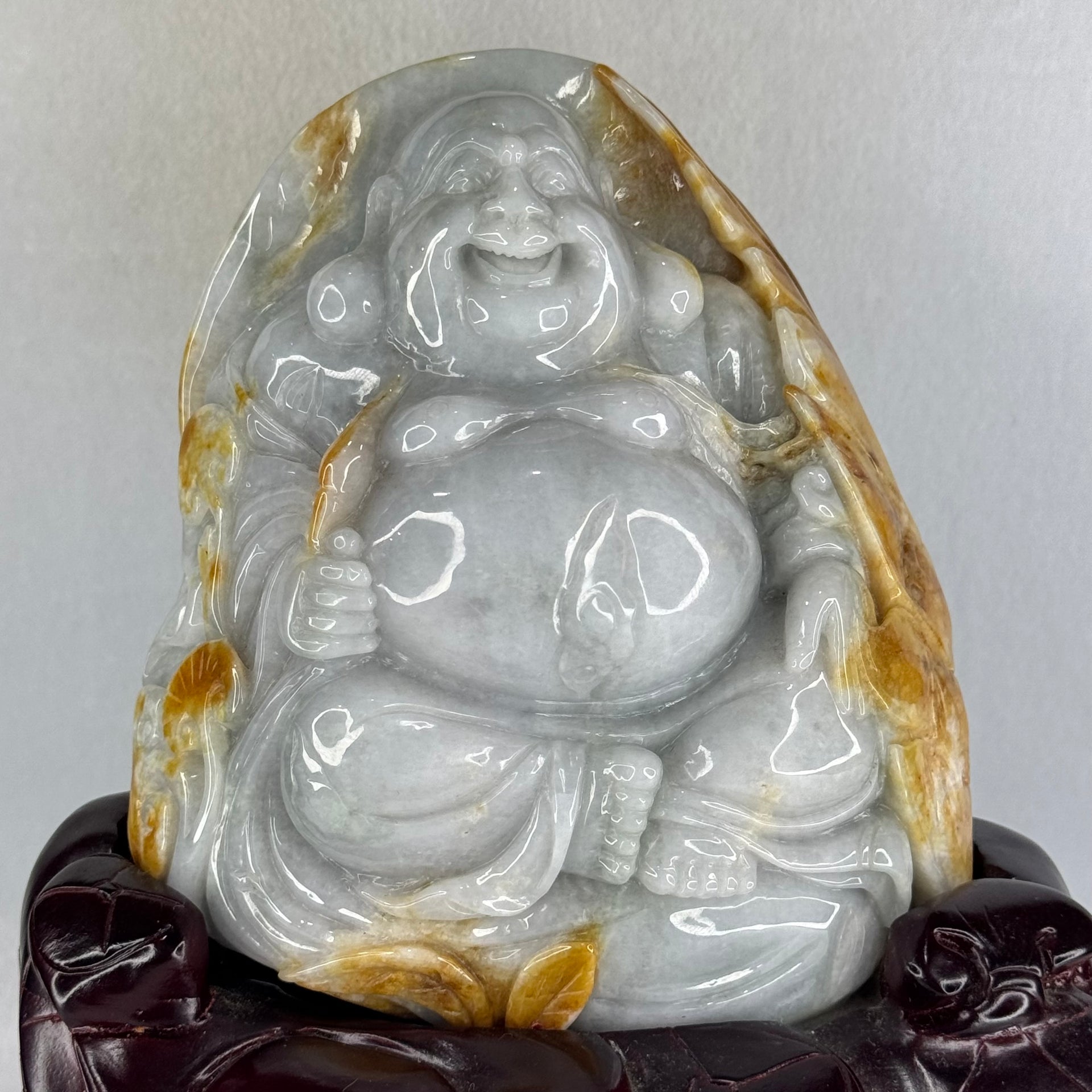 Type A Light Green with Faint Lavender and Yellow Jadeite Milo Buddha Display 170.0 by 100.0 by 190.0mm with wooden stand 2,574.1g - Huangs Jadeite and Jewelry Pte Ltd