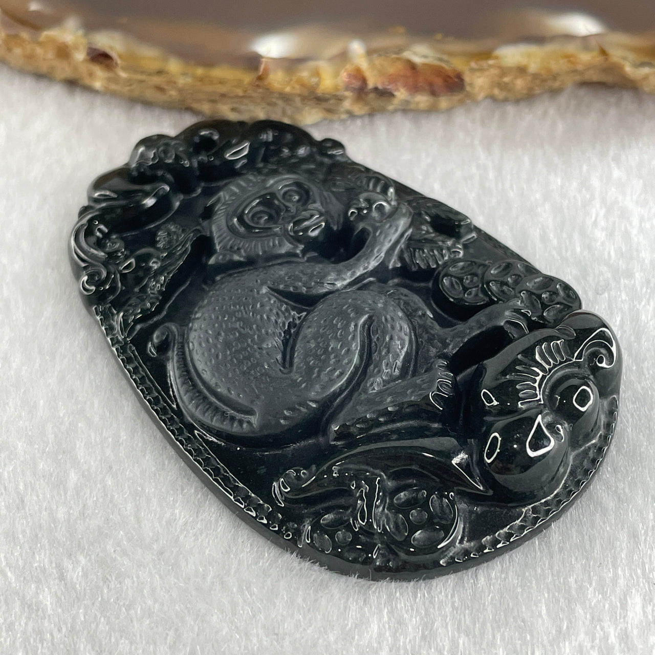 Type A Opaque to Partial Translucent Black Omphacite Jadeite Monkey Pendant 29.60g 59.6 by 40.1 by 8.5mm - Huangs Jadeite and Jewelry Pte Ltd