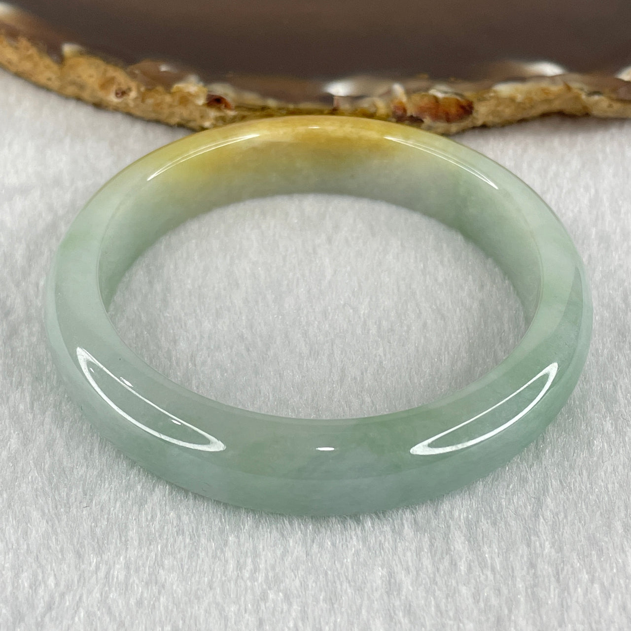 Type A Light Green with Yellow Piao Hua Jadeite Bangle 47.89g Internal Diameter 55.6mm 12.2 by 7.6mm (Slight Internal Lines) - Huangs Jadeite and Jewelry Pte Ltd