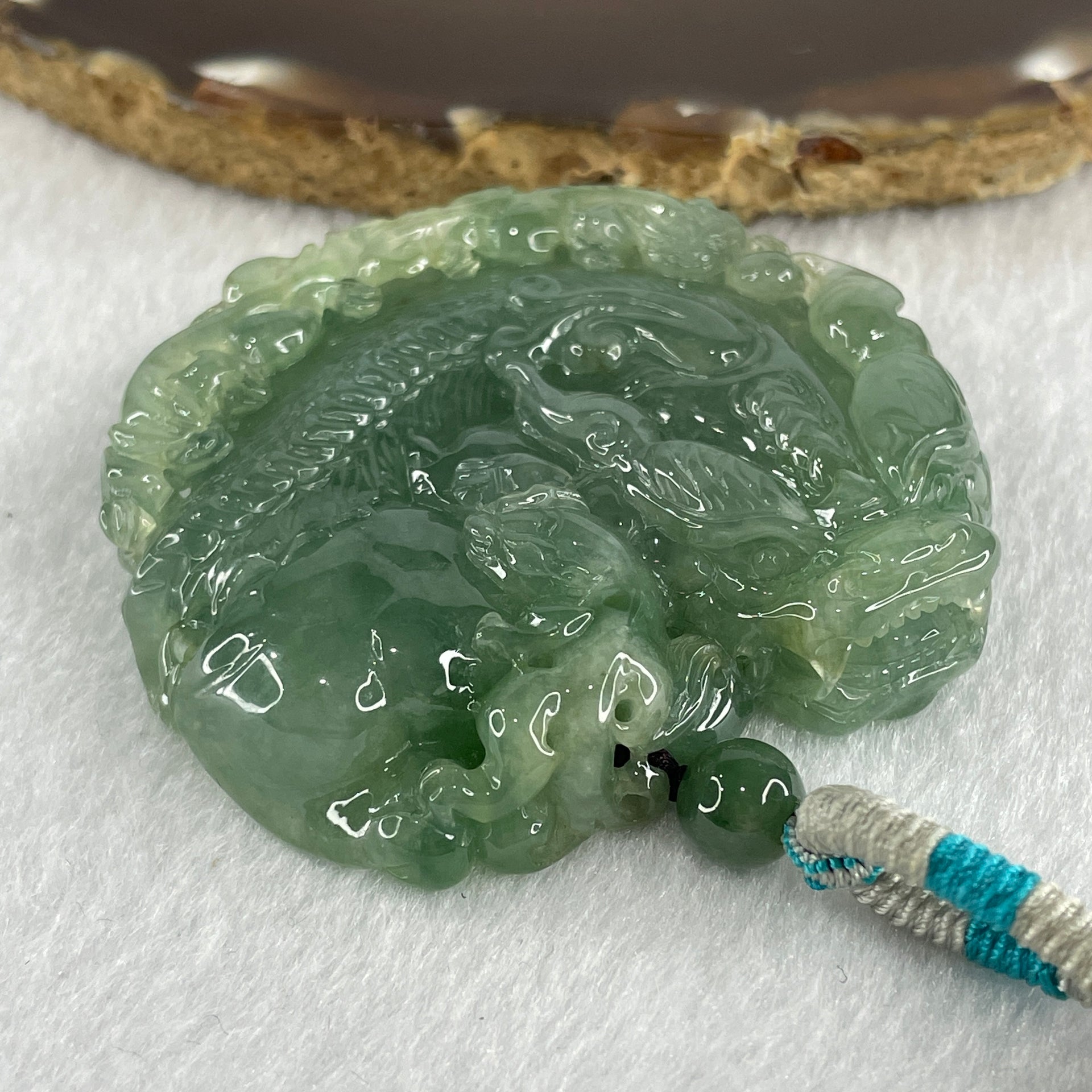 Grand Master Type A Semi Icy Light Green Jadeite Pixiu with 3 Baby Pixiu Double Side Pendant 75.67g 49.0 by 53.5 by 13.3mm - Huangs Jadeite and Jewelry Pte Ltd