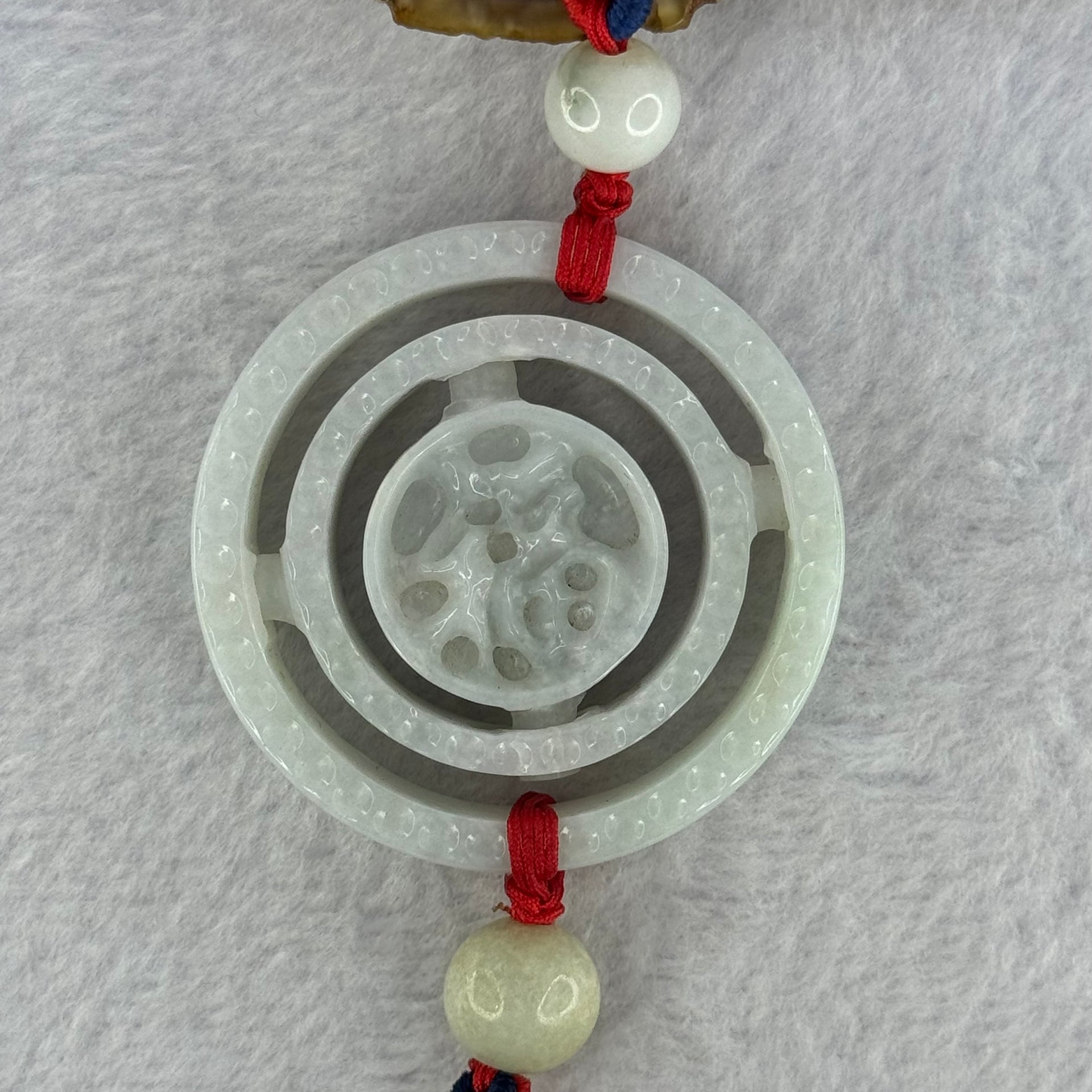 Type A Green Jadeite 3 Tiers Movable Ping An Kou Donut Display 54.49g 55.3 by 13.0mm - Huangs Jadeite and Jewelry Pte Ltd