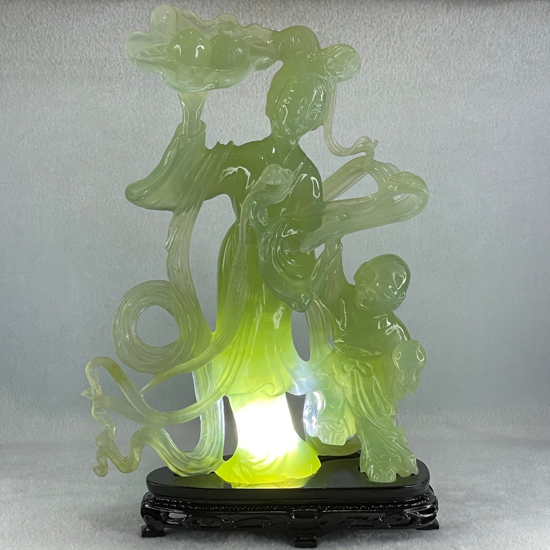 Natural Semi Icy Green Serpentine Fairy with Tong Zhi and Lotus Flower with Wooden Stand Display 1,228.0g 196.0 by 76.0 by 283.0mm - Huangs Jadeite and Jewelry Pte Ltd