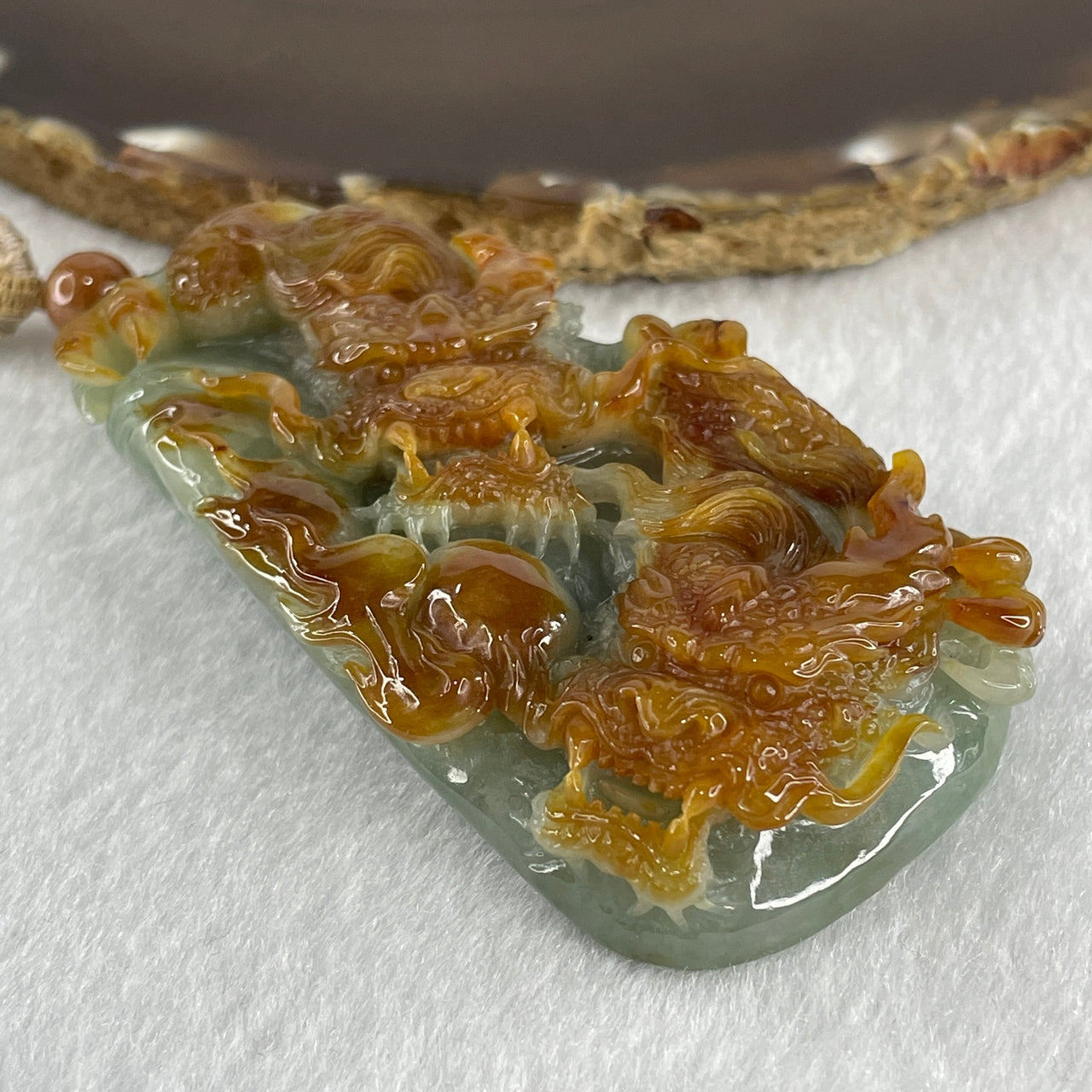 Grand Master Type A Green with Brownish Jadeite Dragon Double Side Pendant 125.78g 77.7 by 46.4 by 18.2mm