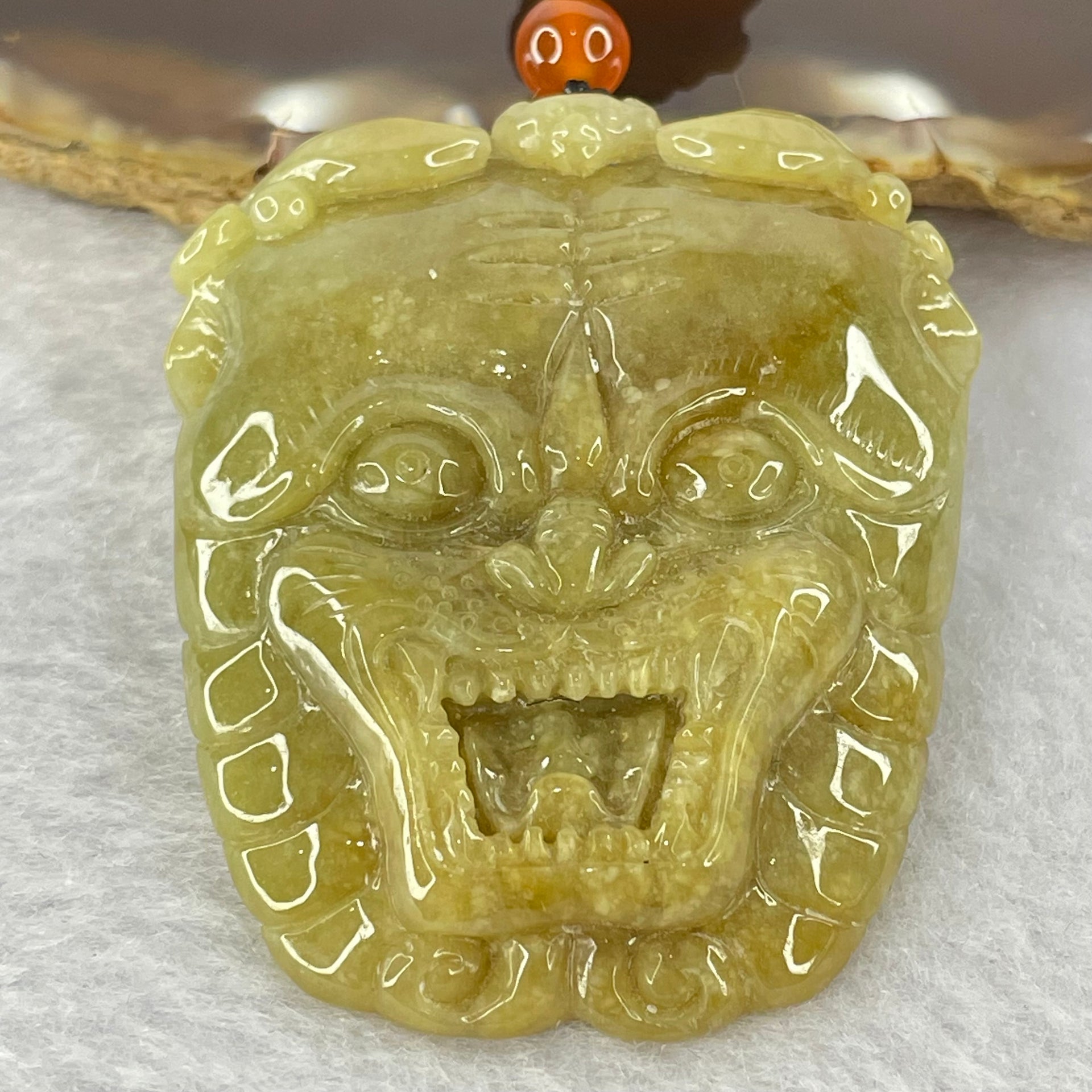 Type A Yellowish Brown Jadeite Tiger Head Pendent 48.59g 49.3 by 42.1 by 12.0mm - Huangs Jadeite and Jewelry Pte Ltd