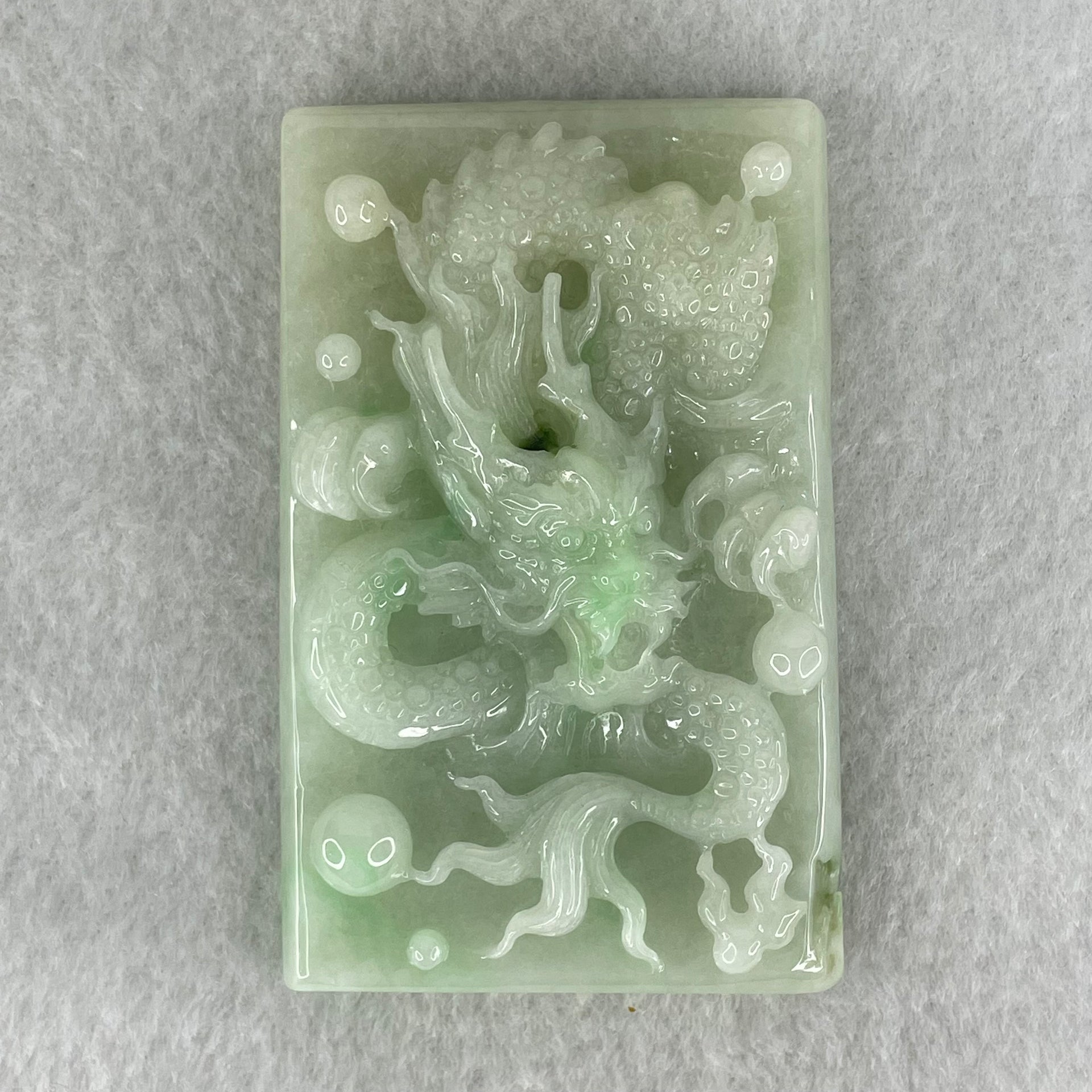 Type A Light Apple Green Jadeite Dragon Pendant 87.90g 69.4 by 44.2 by 14.2mm - Huangs Jadeite and Jewelry Pte Ltd