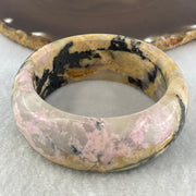 Entry Grade Natural Yellow with Black Rhodonite Bangle 105.93g Inner Diameter 55.2mm 25.5 by 11.7mm - Huangs Jadeite and Jewelry Pte Ltd