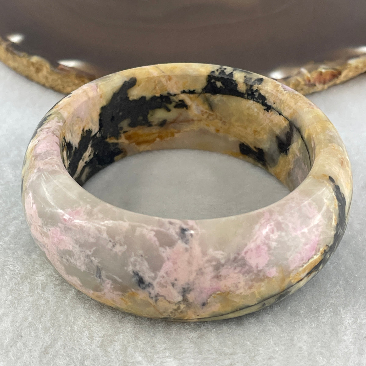 Entry Grade Natural Yellow with Black Rhodonite Bangle 105.93g Inner Diameter 55.2mm 25.5 by 11.7mm - Huangs Jadeite and Jewelry Pte Ltd
