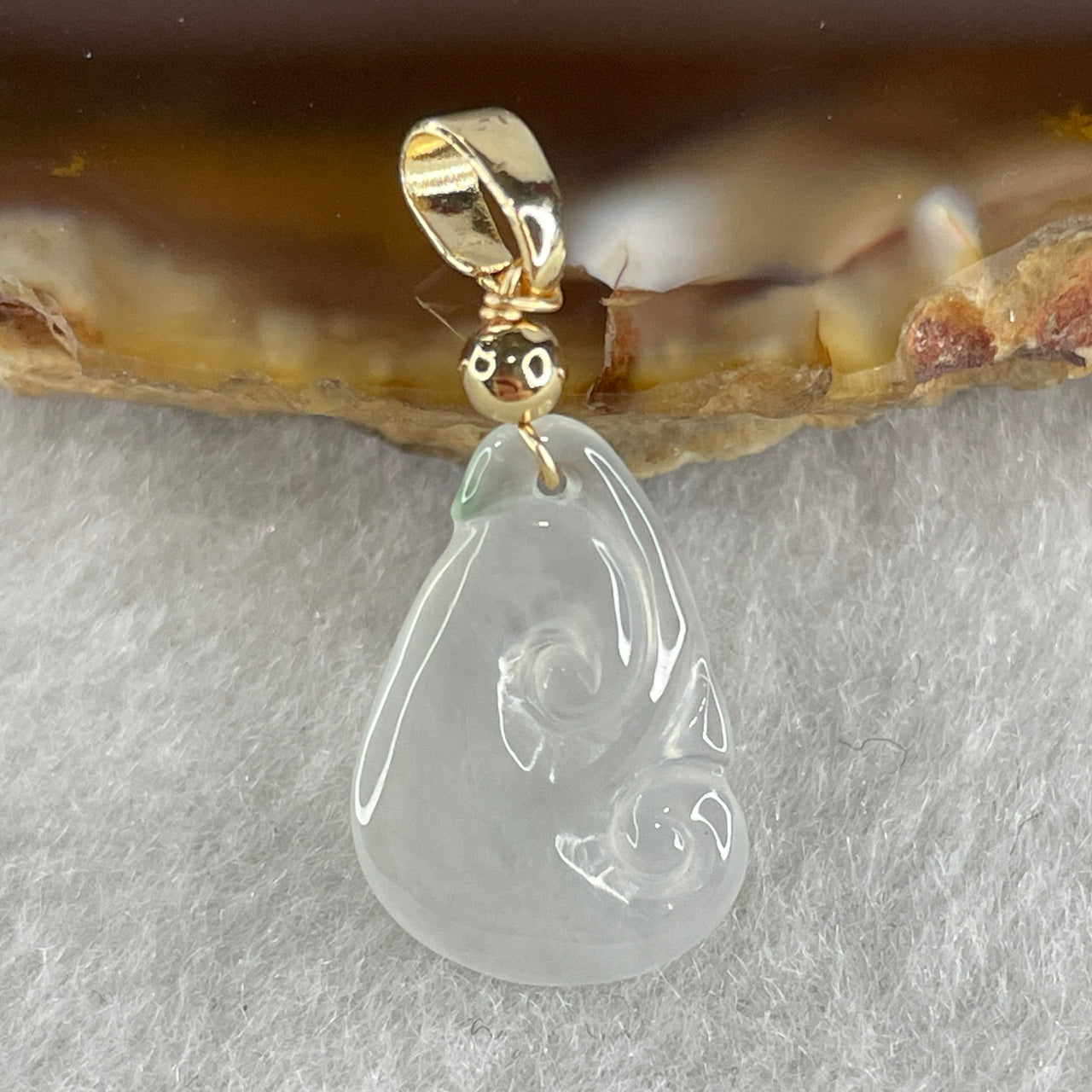 Type A Icy White to Colorless with Green Spot Jadeite Ruyi Pendant 0.82g 1.62 by 10.9 by 2.2mm - Huangs Jadeite and Jewelry Pte Ltd