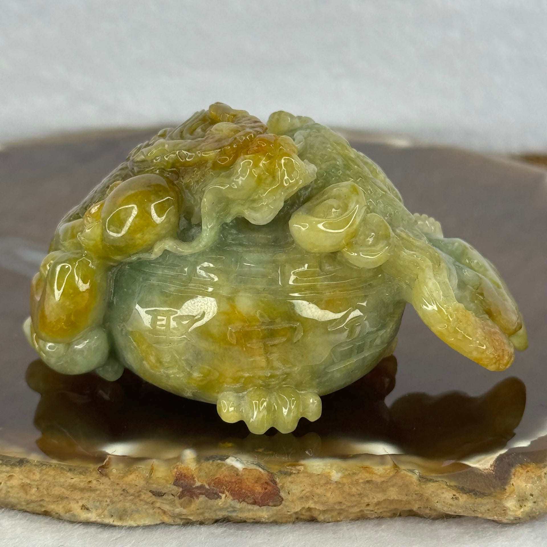 Grand Master Type A Blueish Green with Brownish Yellow Jadeite Dragon on Wealth Pot with Treasures 133.13g 36.0 by 69.3 by 39.5mm - Huangs Jadeite and Jewelry Pte Ltd