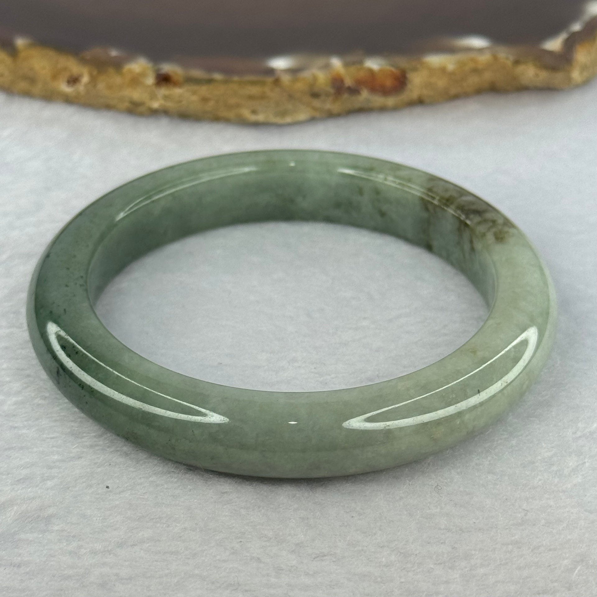 Type A Green with Light Green and Brown Jadeite Bangle 48.75g Internal Diameter 54.1mm 10.7 by 8.9mm (Very Slight Fine Line) - Huangs Jadeite and Jewelry Pte Ltd