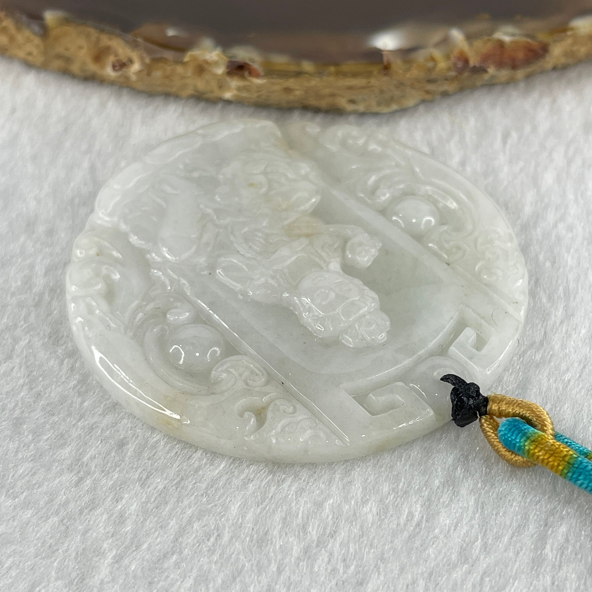 Natural Type A Faint Lavender Faint Green with Red Spots Jadeite Guan Yin Bodhisattva or Siṃhanāda Avalokiteśvara or Guanyin on Lion Roar Pendant 28.42g 51.0 by 5.6mm - Huangs Jadeite and Jewelry Pte Ltd