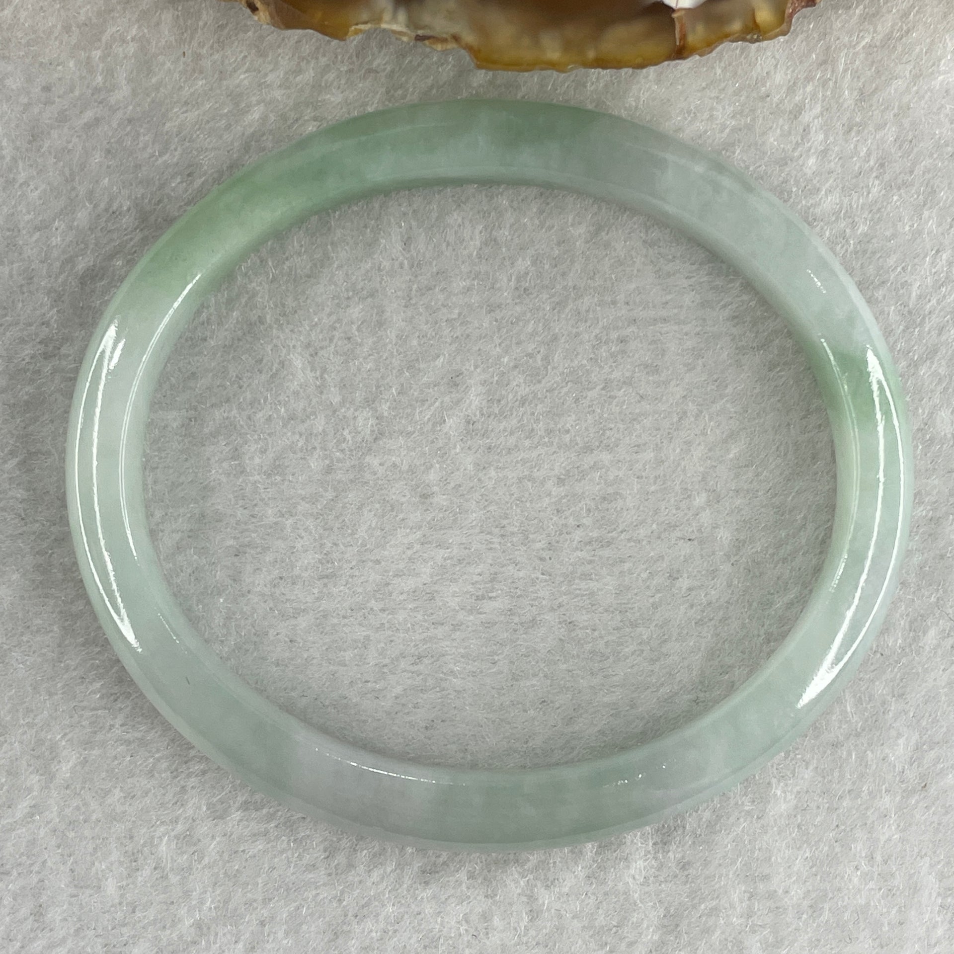 Certified Type A Light Green with Green Patches Jadeite Oval Bangle Internal Diameter 54.3mm 20.69g 7.5 by 6.4mm ( Very Slight Internal Lines ) - Huangs Jadeite and Jewelry Pte Ltd
