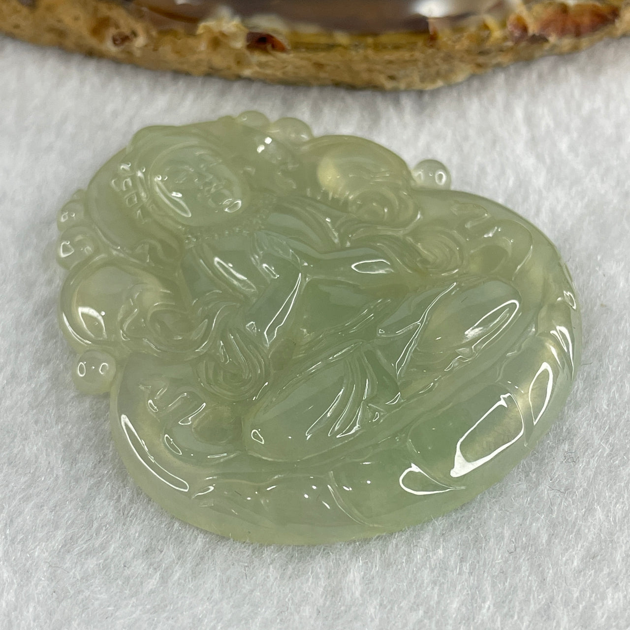 Natural Type A High Icy Light Green Jadeite Guan Yin Pendant 24.77g 54.9 by 47.4 by 6.1mm