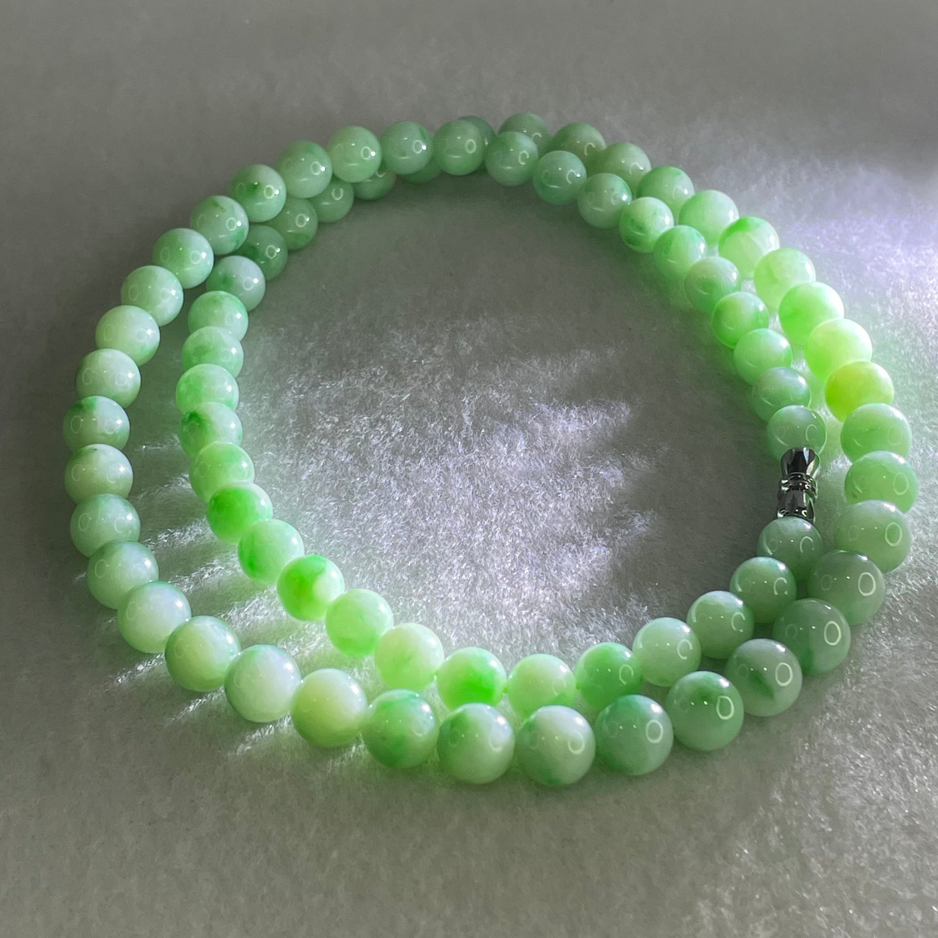 Good Grade Type A Apple Green with Emerald Green Piao Hua Jadeite Beads Necklace 55.48g 54cm 7.1 to 8.2mm 73 Beads - Huangs Jadeite and Jewelry Pte Ltd