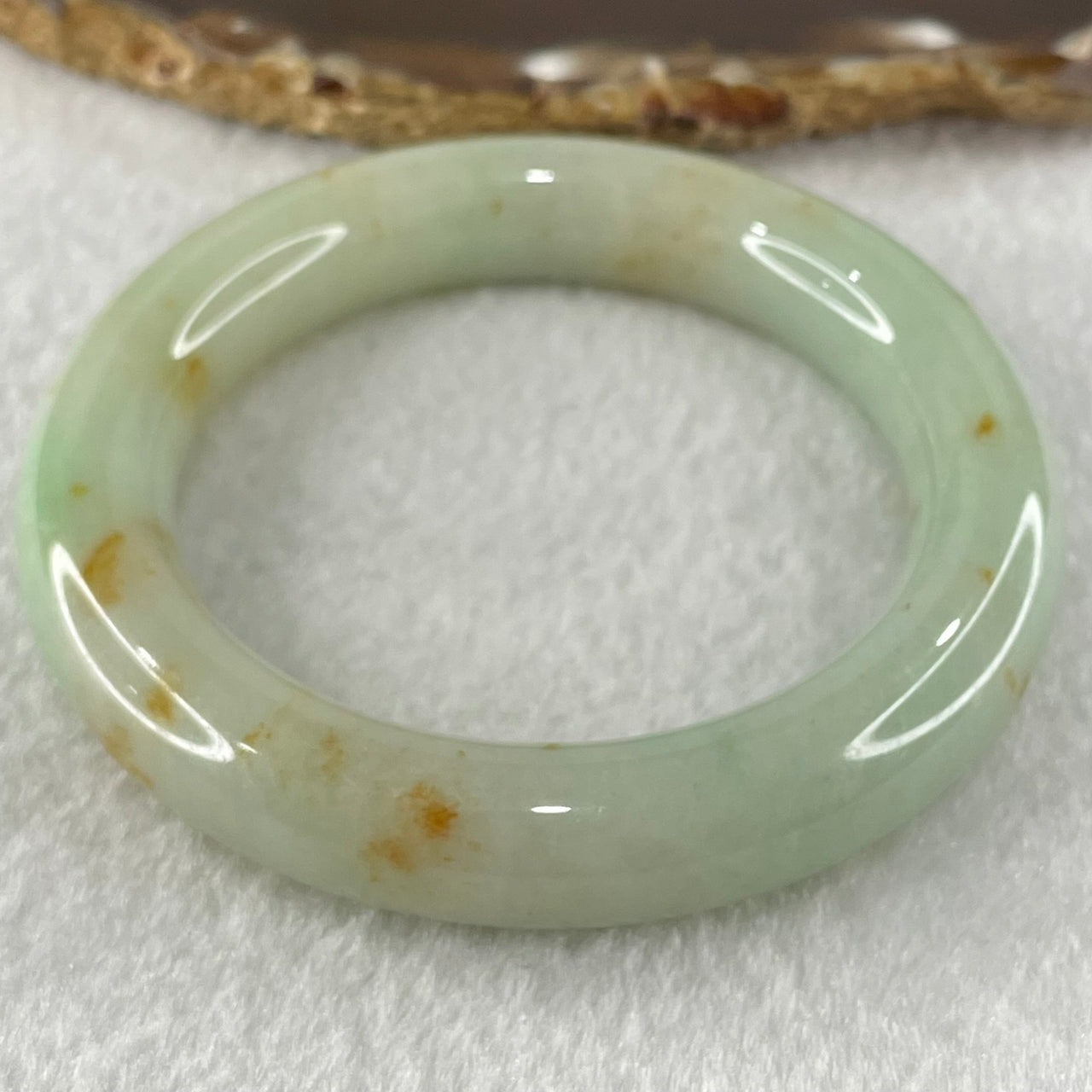 Type A Light Apple Green with Brownish Red Patches Jadeite Bangle 69.71g Internal Diameter 52.8mm 12.4 by 11.0mm (Close to Perfect) - Huangs Jadeite and Jewelry Pte Ltd