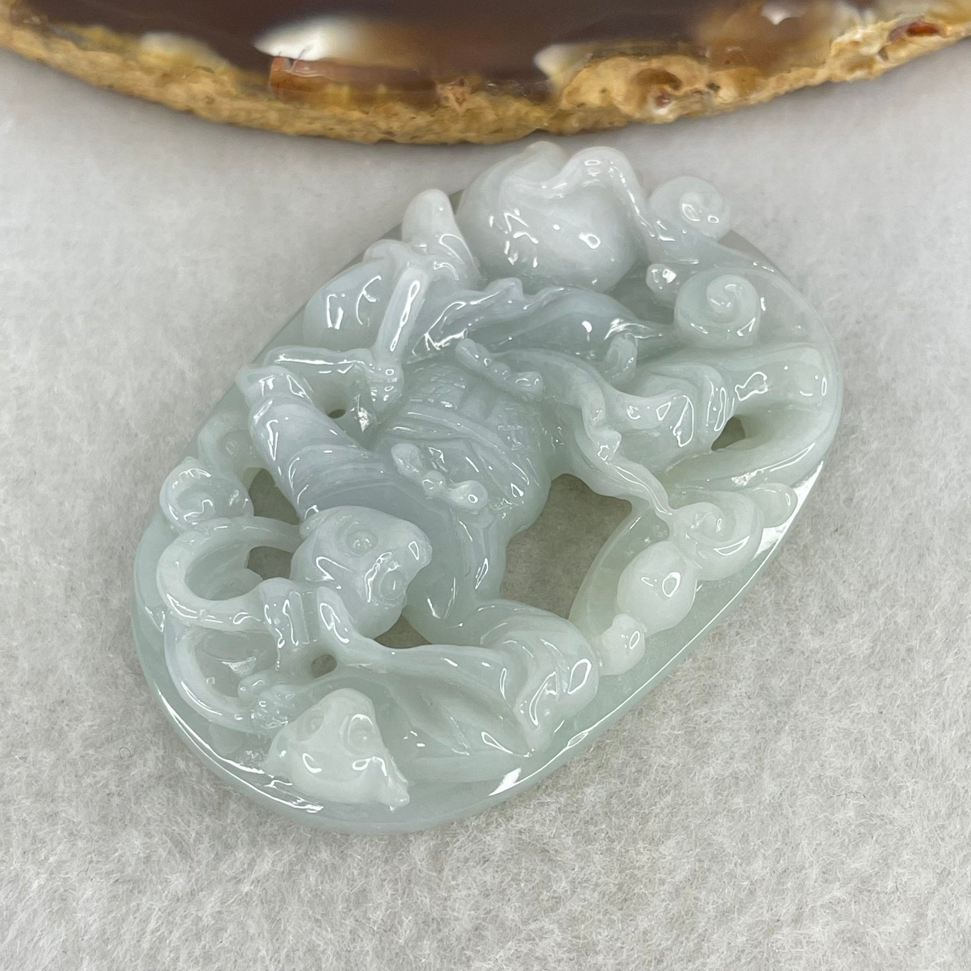 Type A Light Sky Blue Jadeite Sun Wu Kong Pendant 27.49g 52.8 by 37.1 by 11.0mm - Huangs Jadeite and Jewelry Pte Ltd