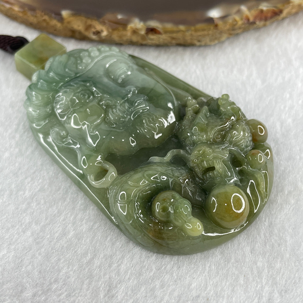 Natural Type A Blueish Green with Light Brown Jadeite Good Vs Evil (Buddha Vs Devil) with Dragon 80.23g 68.0 by 43.7 by 12.3mm