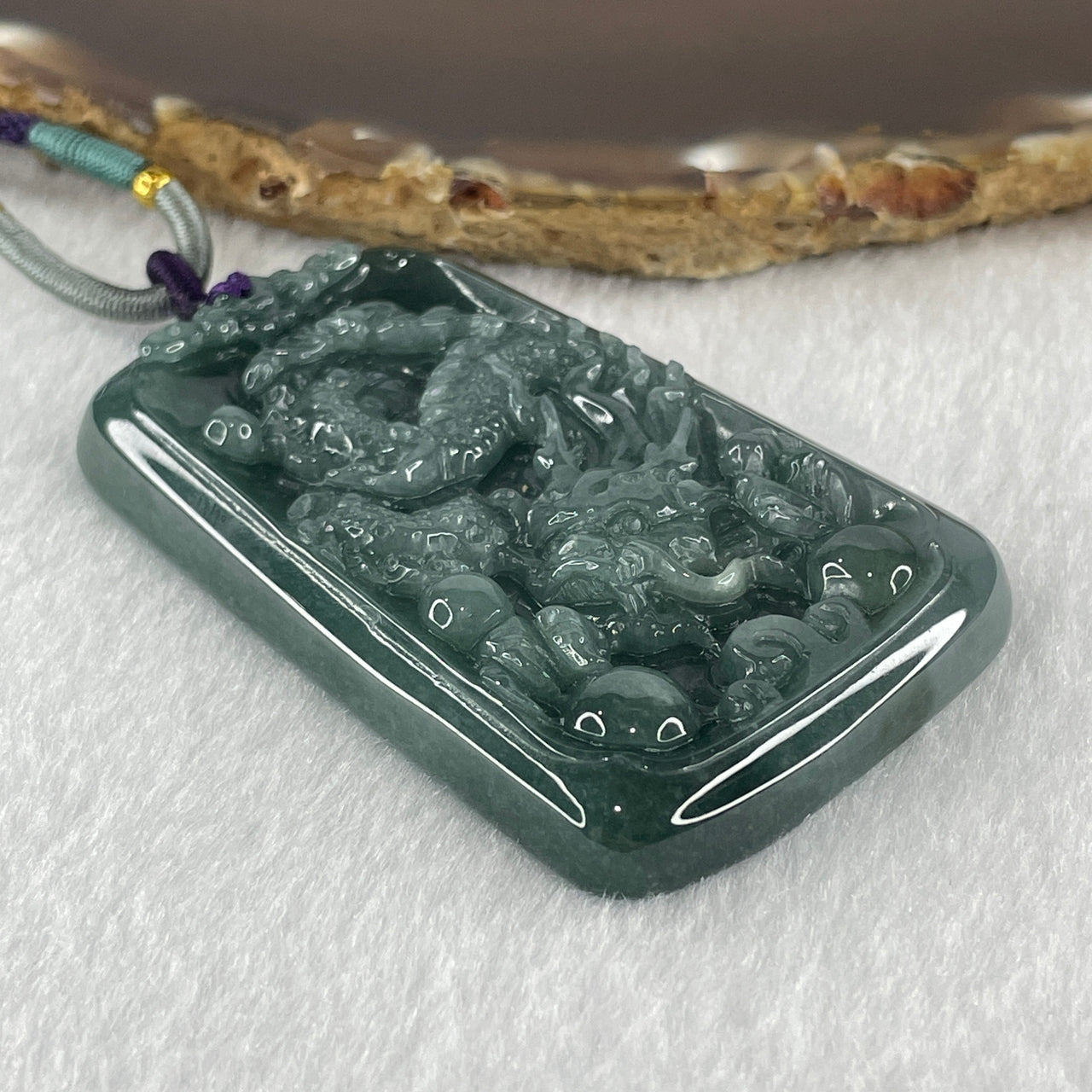 Type A Blueish Green Jadeite Dragon Pendant 47.61g 61.6 by 39.8 by 8.1mm