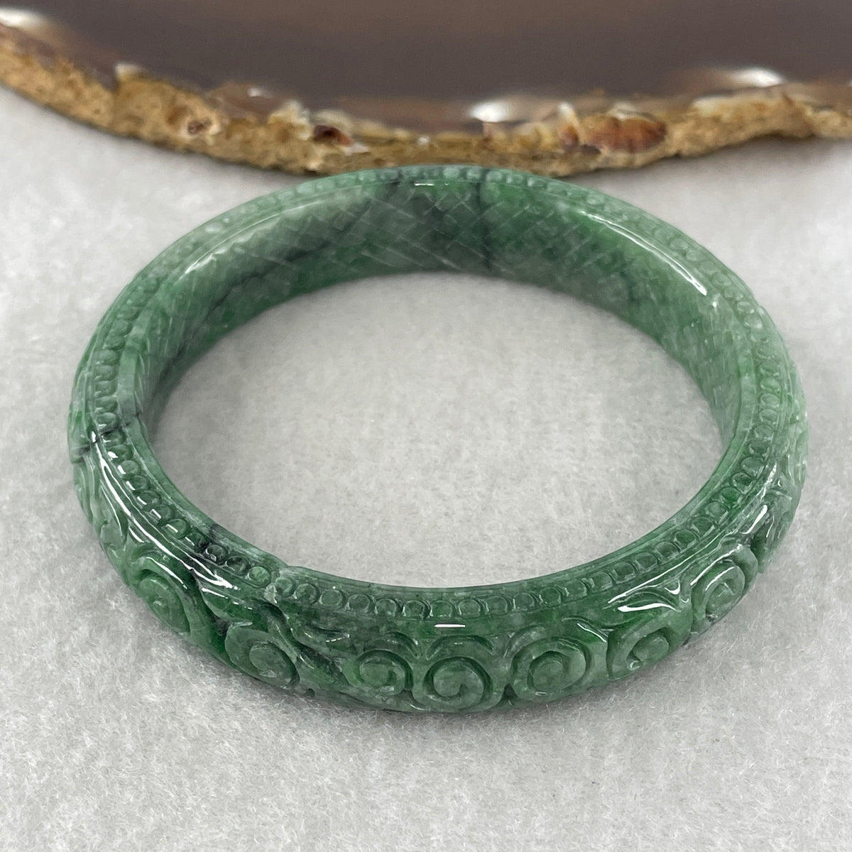 Natural Type Green Jadeite Prosperity Flowers Bangle 46.28g Inner Diameter 55.6mm 12.1 by 8.2mm (External Line) - Huangs Jadeite and Jewelry Pte Ltd