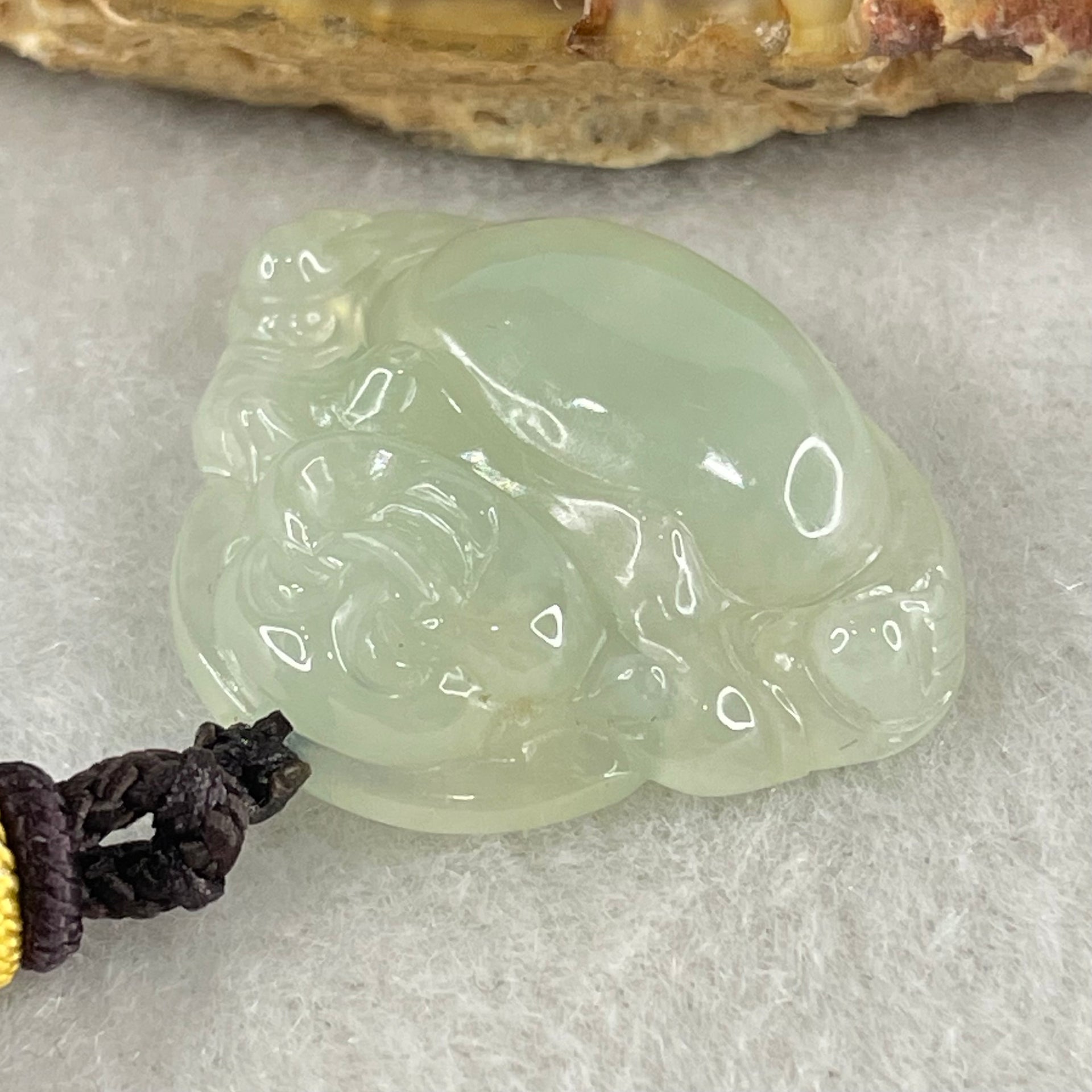 Type A Icy Faint Green Jadeite Milo Buddha Pendant 3.01g 22.4 by 27.1 by 6.0mm - Huangs Jadeite and Jewelry Pte Ltd
