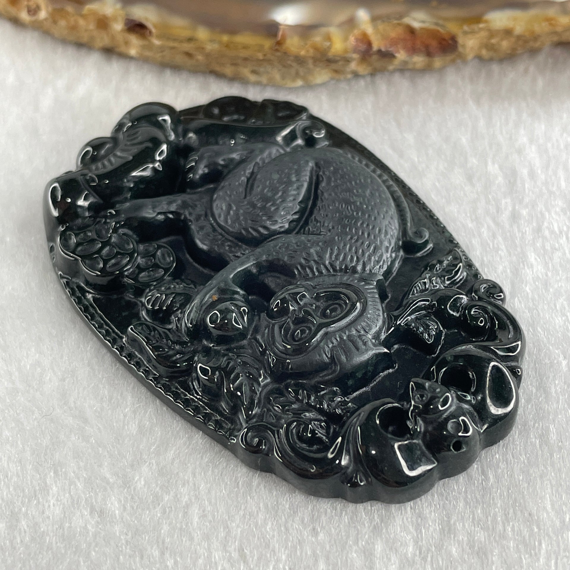 Type A Opaque to Partial Translucent Black Omphacite Jadeite Monkey Pendant 29.60g 59.6 by 40.1 by 8.5mm - Huangs Jadeite and Jewelry Pte Ltd