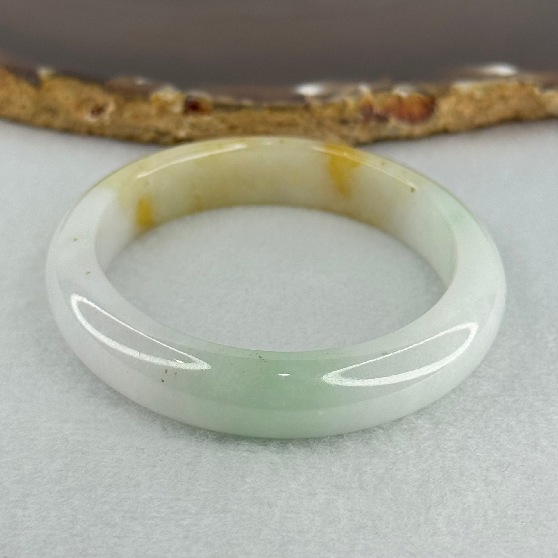 Type A Faint Lavender Green with Yellow Patches Jadeite Oval Bangle Internal Diameter 56.5mm  37.8696g 11.1 by 7.3mm (Very Slight Internal Line) - Huangs Jadeite and Jewelry Pte Ltd