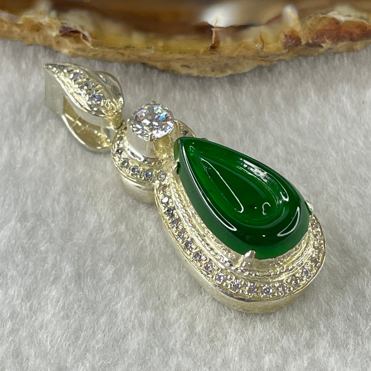 Type A Natural Semi Icy Bright Green Jadeite Tear Drop Shape Stone for Setting 18.1 by 10.5 by 3.0mm (On Silver Pendant Mold) 15.22g - Huangs Jadeite and Jewelry Pte Ltd