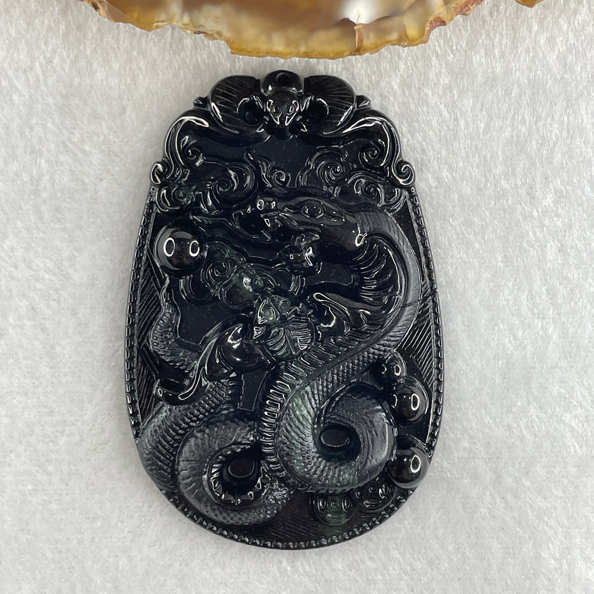 Type A Opaque to Partial Translucent Black Omphacite Jadeite Snake Pendant 24.70g 59.7 by 40.1 by 8.5mm - Huangs Jadeite and Jewelry Pte Ltd