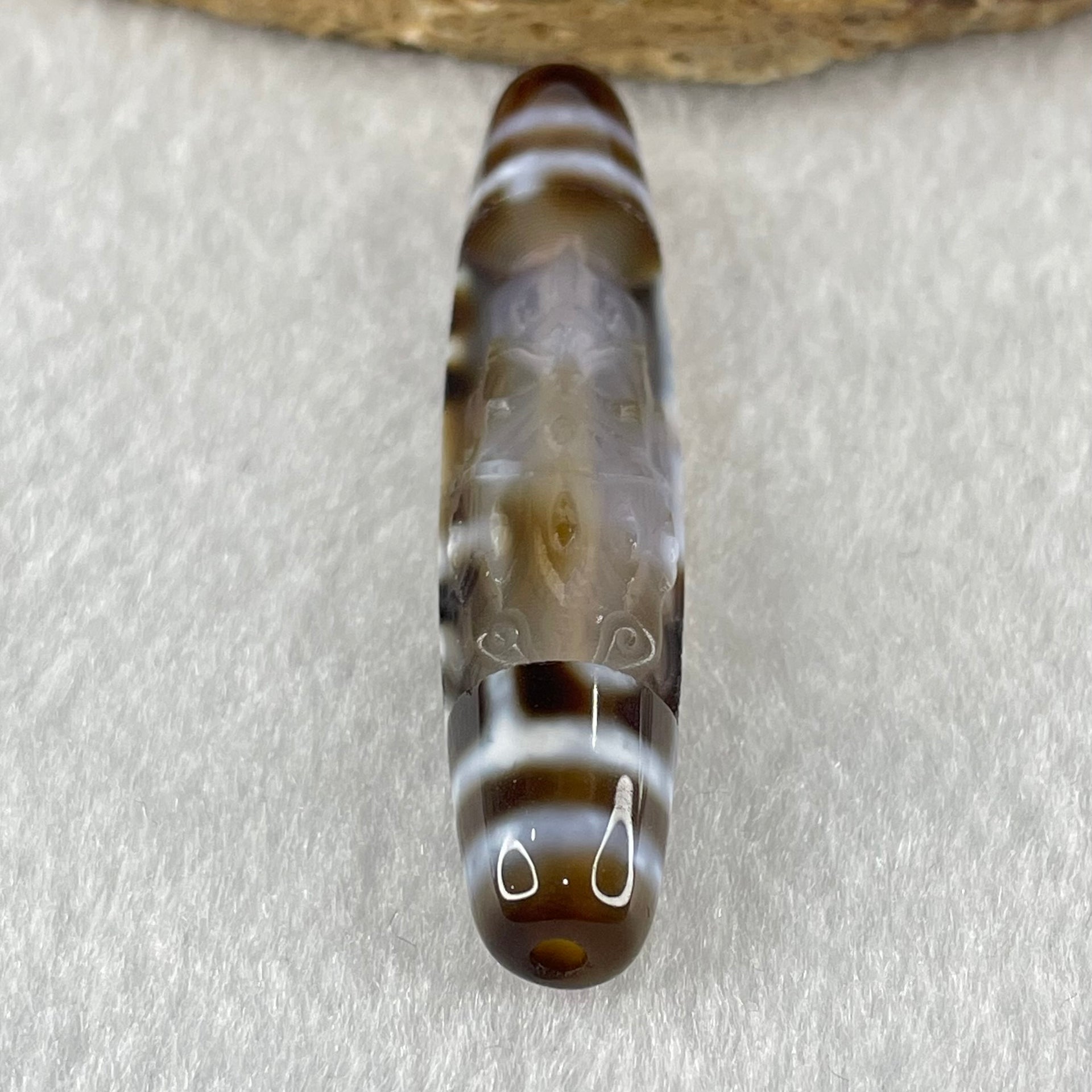 Natural Powerful Tibetan Old Oily Agate Zha Ji La Mu Female Cai Shen Carvings on 9 Eyes Dzi Bead Heavenly Master (Tian Zhu) 九眼扎基拉姆女财神天珠 11.04g 57.9 by 12.0mm - Huangs Jadeite and Jewelry Pte Ltd