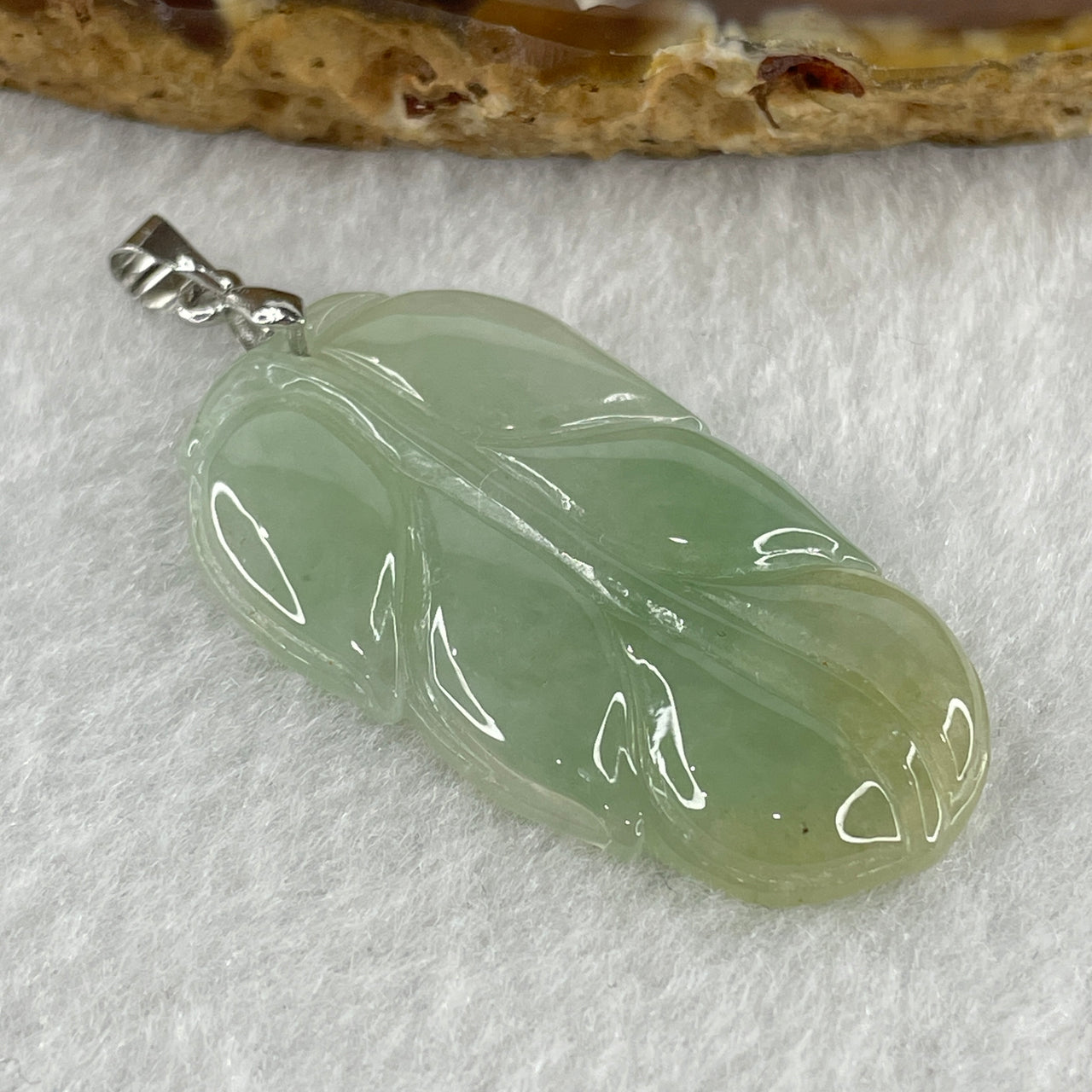 Natural Type A Semi Icy Light Green with Light Yellow Jadeite Prosperity Leaf Pendant in Silver Clasp Signifying Overnight Success 6.55g 38.4 by 21.6 by 4.0mm - Huangs Jadeite and Jewelry Pte Ltd