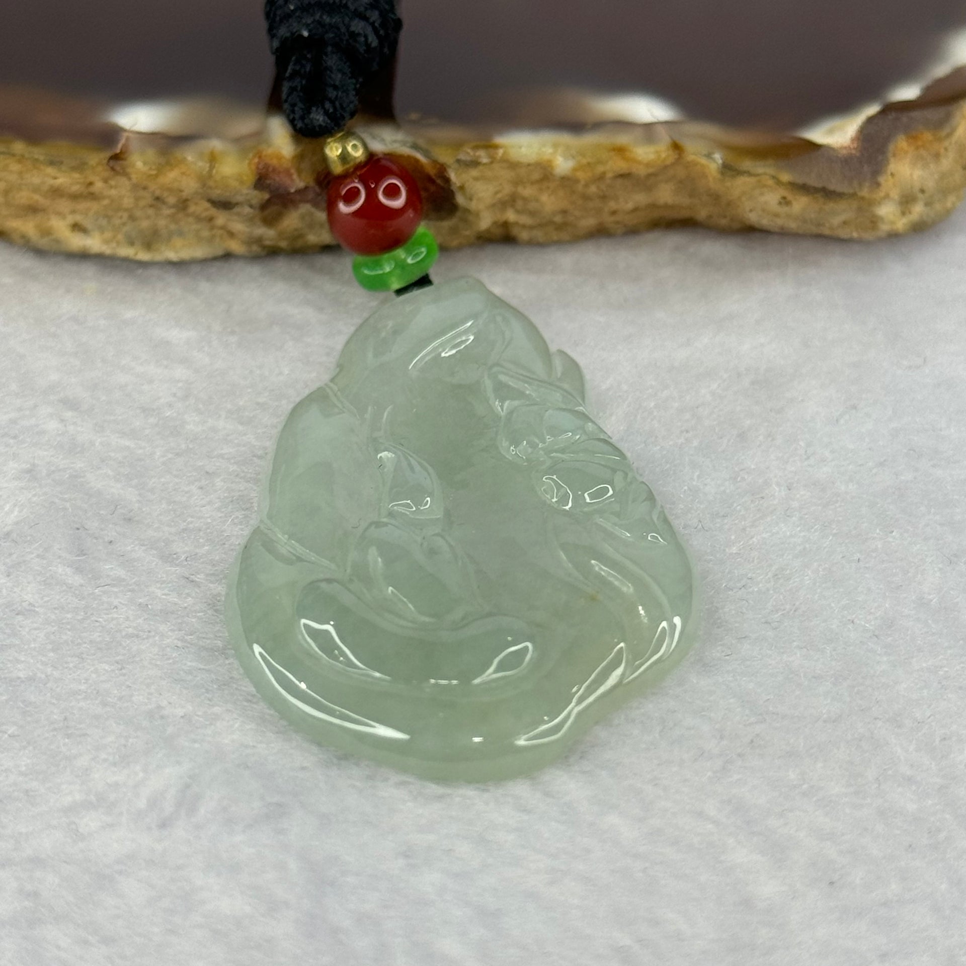 Type A Semi ICY Light Green Jadeite Benefactor with Lotus Flower Pendent 12.08g 46.4 by 27.6 by 4.8mm - Huangs Jadeite and Jewelry Pte Ltd