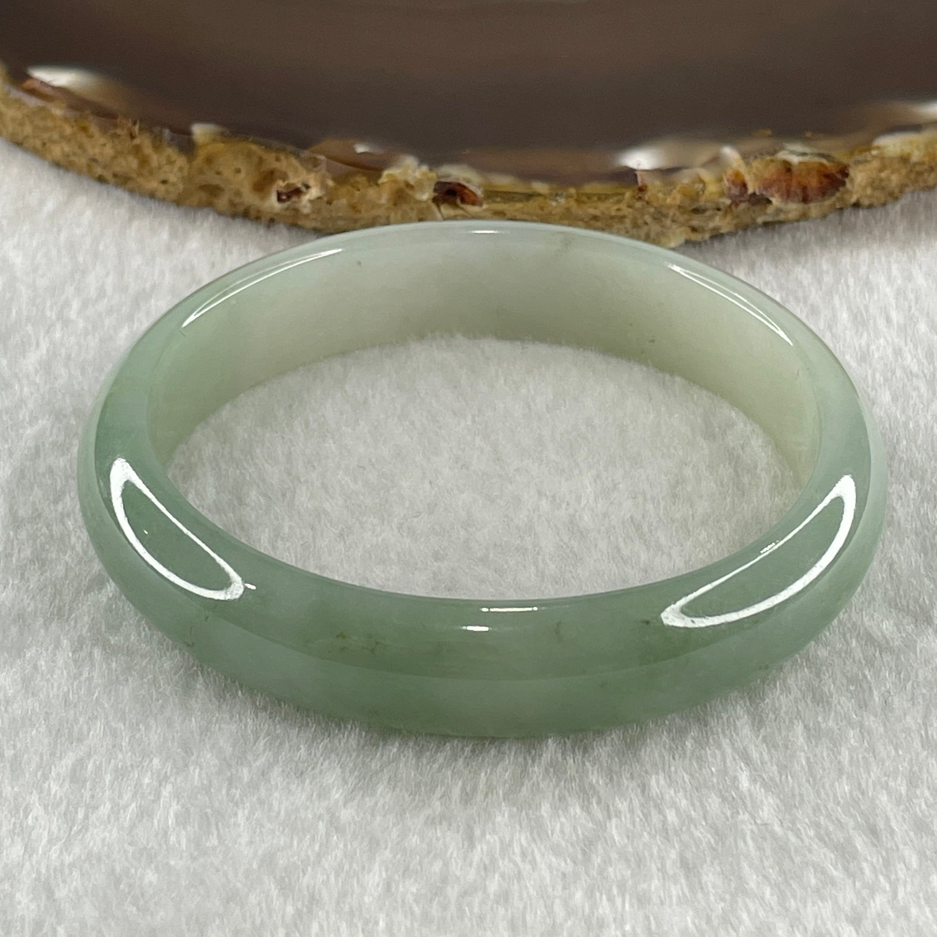 Natural Type A Jelly Light to Faint Green Jadeite Oval Bangle 36.74g Inner Diameter 55.0mm 12.0 by 6.5mm (Close to Perfect) - Huangs Jadeite and Jewelry Pte Ltd