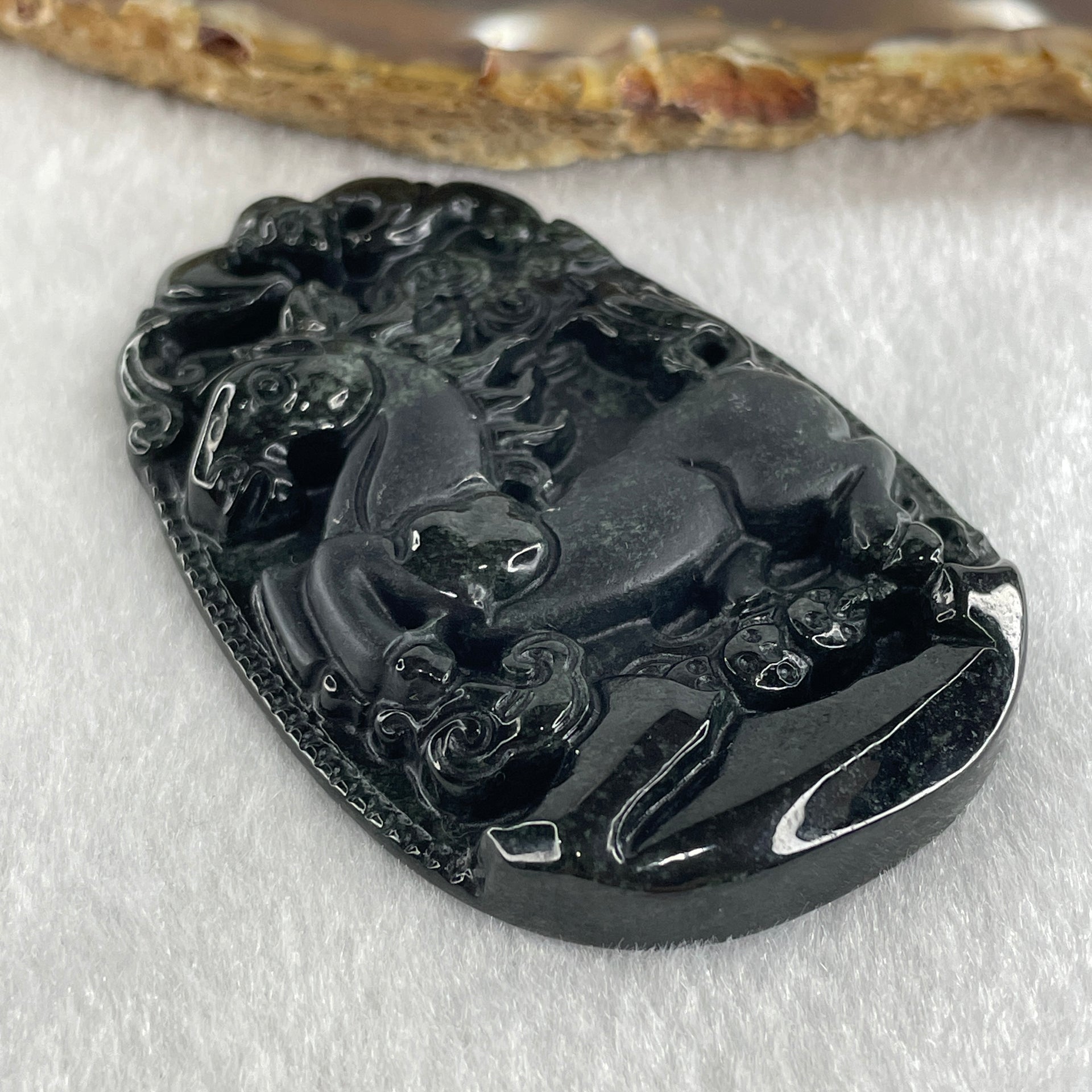 Type A Opaque to Partial Translucent Black Omphacite Jadeite Horse Pendant 26.34g 60.1 by 40.3 by 8.0mm - Huangs Jadeite and Jewelry Pte Ltd