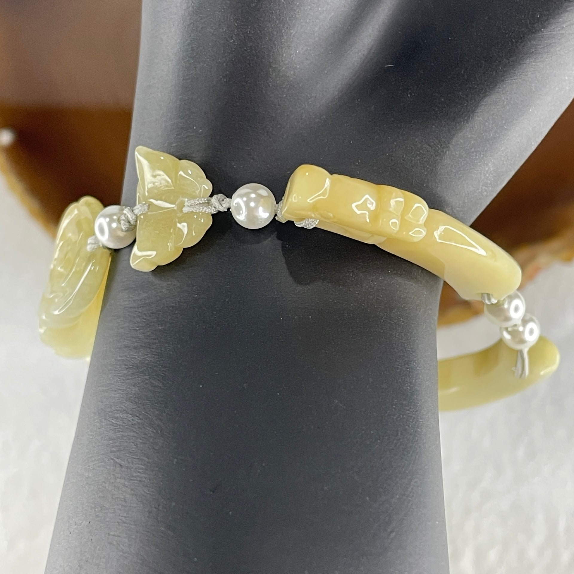 Natural Type A Light Yellowish with Light Green Jadeite Flowers with Dragon Head and Butterfly Bracelet 25.67g 7.2 by 8.4mm - Flower 40.4 by 16.5 by 6.1mm - Huangs Jadeite and Jewelry Pte Ltd