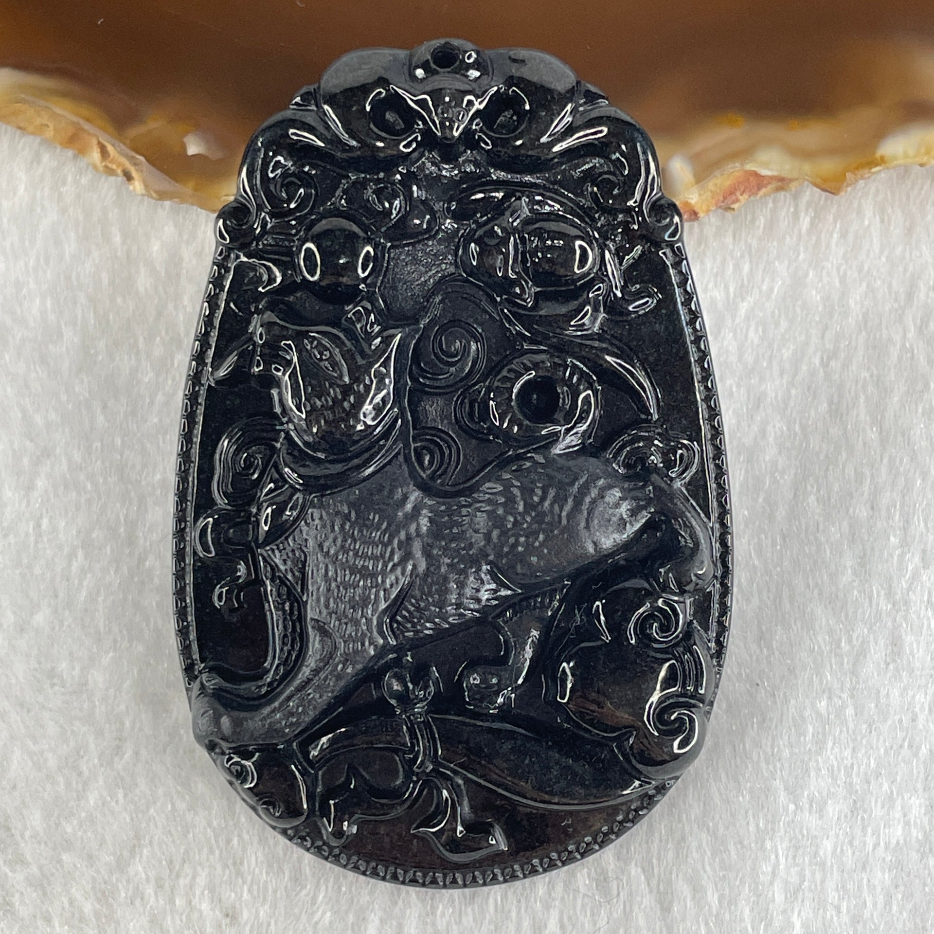 Type A Opaque to Partial Translucent Black Omphacite Jadeite Dog Pendant 23.89g 59.8 by 39.8 by 8.6mm - Huangs Jadeite and Jewelry Pte Ltd