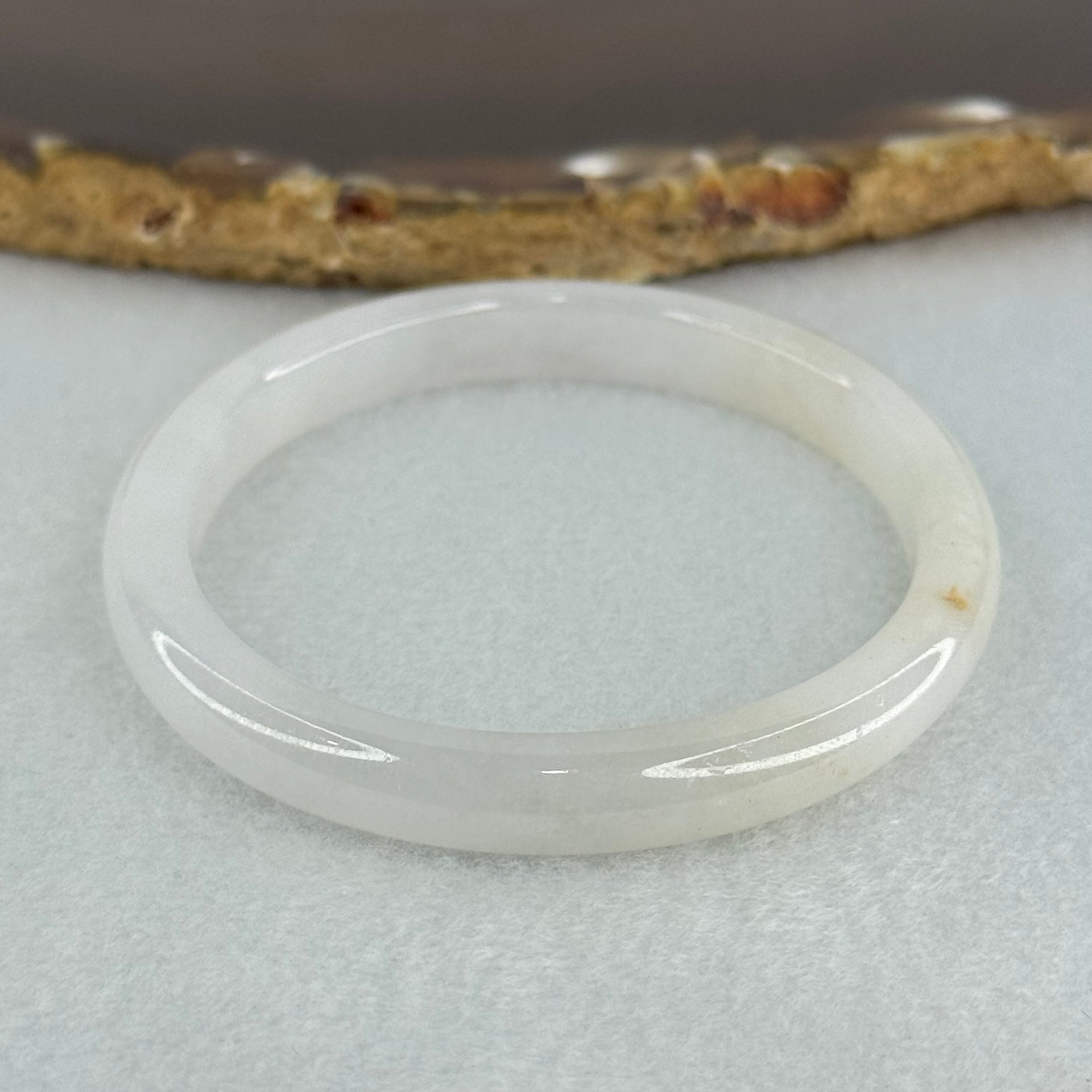 Type A Semi Icy Faint Lavender Green with Reddish Spot Jadeite Oval Bangle Internal Diameter 54.4mm 21.33g 7.5 by 6.0mm (very slight internal line) - Huangs Jadeite and Jewelry Pte Ltd