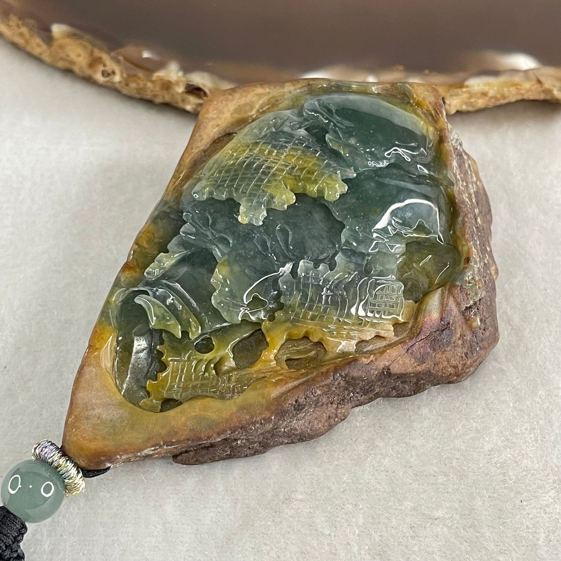 Grand Master Type A Brown with Blueish Green Jadeite Shan Shui with Guiren Benefactor Pendant 107.48g 74.0 by 53.9 by 23.3mm - Huangs Jadeite and Jewelry Pte Ltd