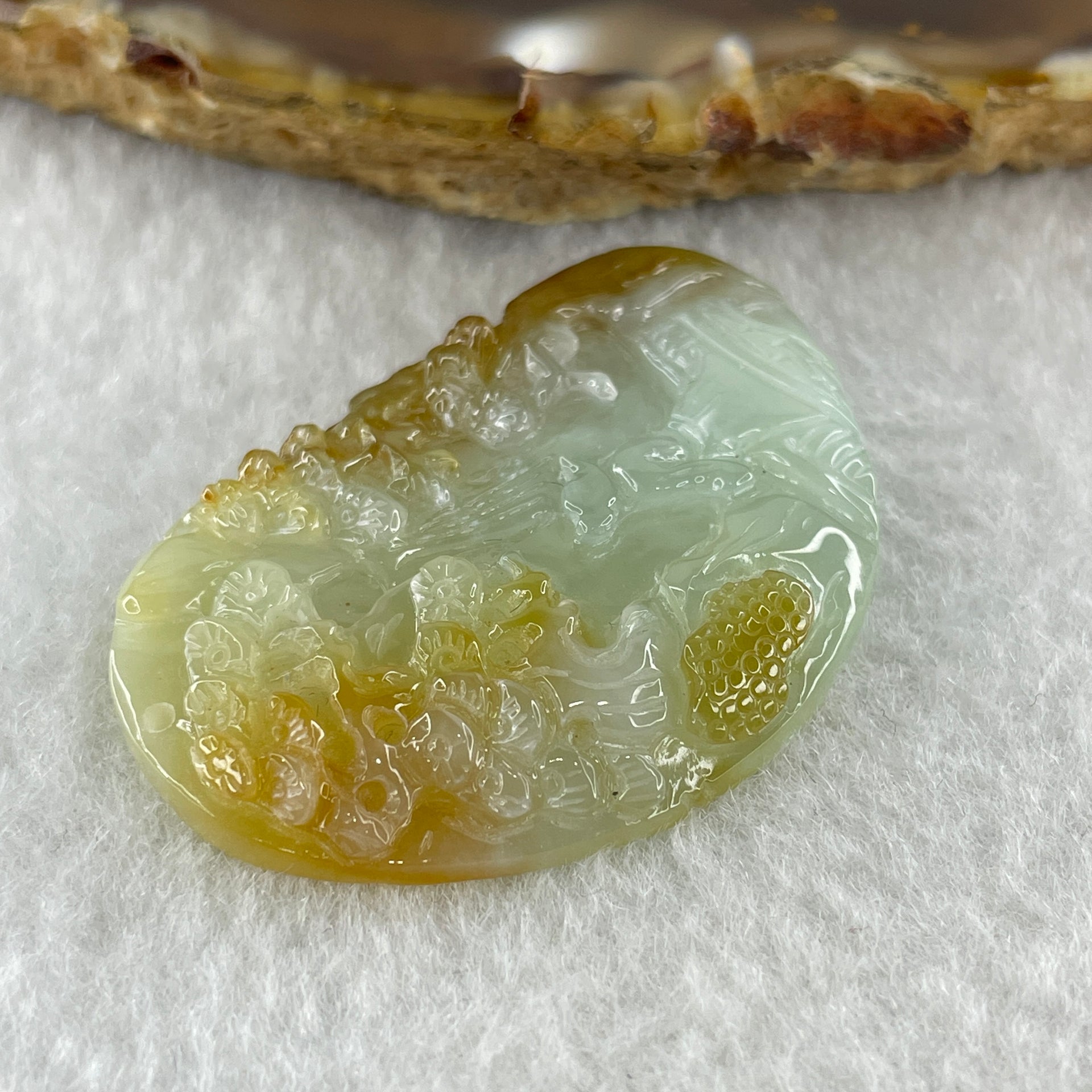 Type A Natural Semi Icy Light Green with Yellow Patches Jadeite Shan Shui Gui Ren Benefactor Pendant 9.79g 38.2 by 25.6 by 6.0mm - Huangs Jadeite and Jewelry Pte Ltd