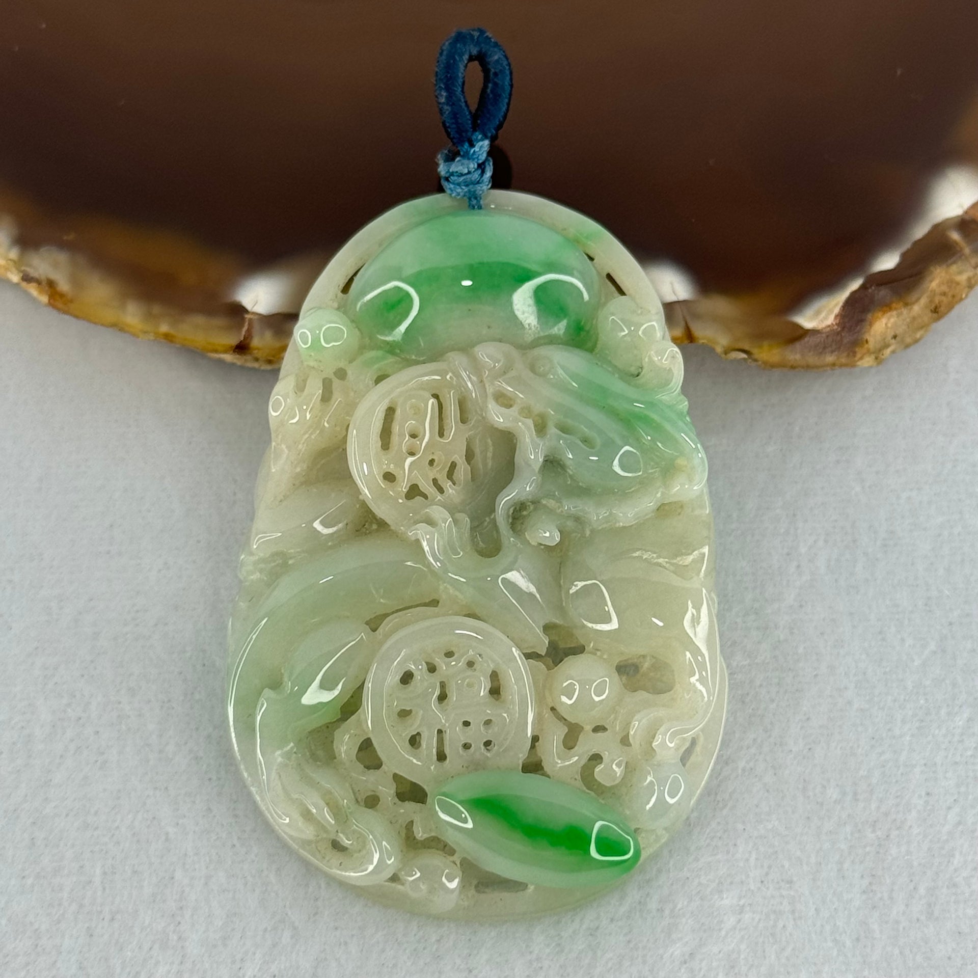 Type A Natural Light Green with Apple Green Jadeite 3D Dragon In Hollow Carving Pendant 27.58g 58.65 by 39.42 by 8.48mm with NGI Cert No. 16824716 - Huangs Jadeite and Jewelry Pte Ltd