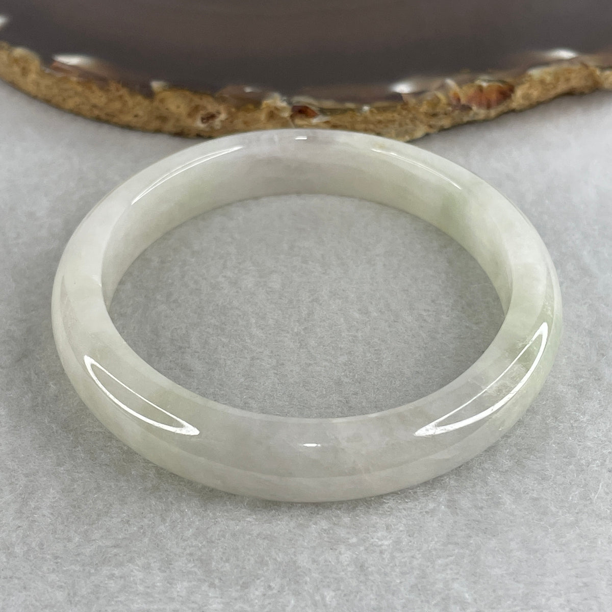 Certified Natural Type A Near White & Faint Green Jadeite Oval Bangle | 65.1mm Inner Diameter (48.42g 10.8x7.7mm | Internal Line, Slight External Rough | Pure Peace & Heart Harmony) - Huangs Jadeite and Jewelry Pte Ltd