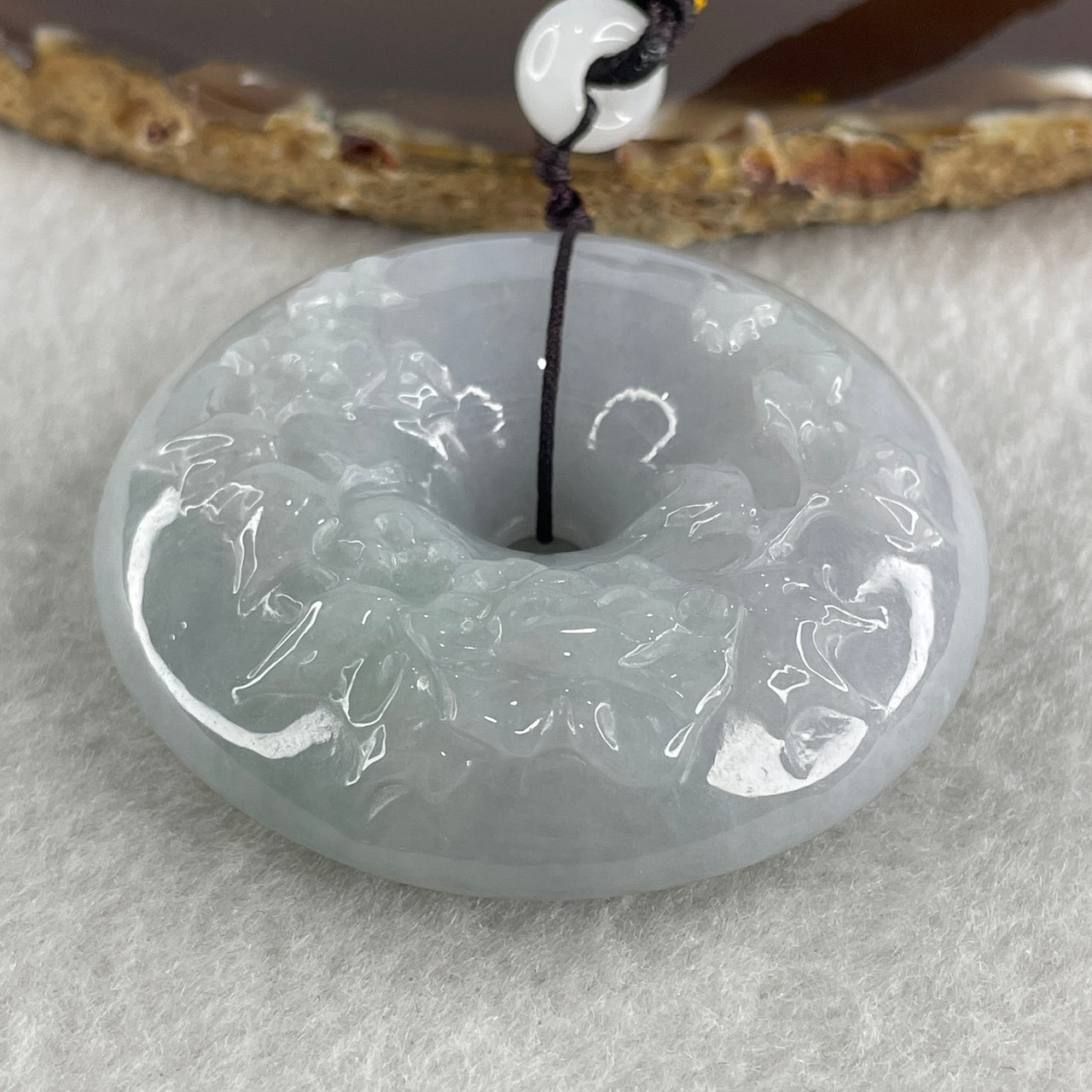 Natural Type A Faint Lavender Jadeite Donut with Flower Caving Pendant 81.69g 53.2 by 15.2mm - Huangs Jadeite and Jewelry Pte Ltd