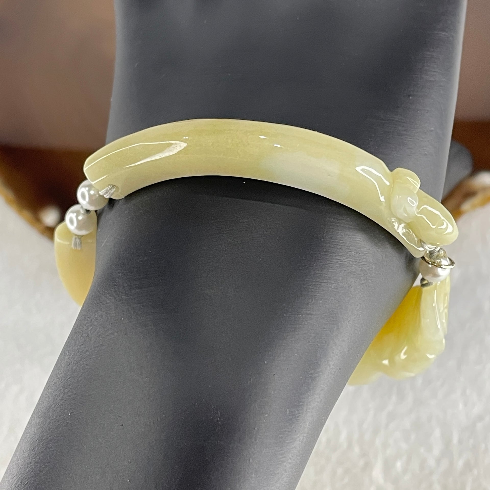 Natural Type A Light Yellowish with Light Green Jadeite Flowers with Dragon Head and Butterfly Bracelet 25.67g 7.2 by 8.4mm - Flower 40.4 by 16.5 by 6.1mm - Huangs Jadeite and Jewelry Pte Ltd