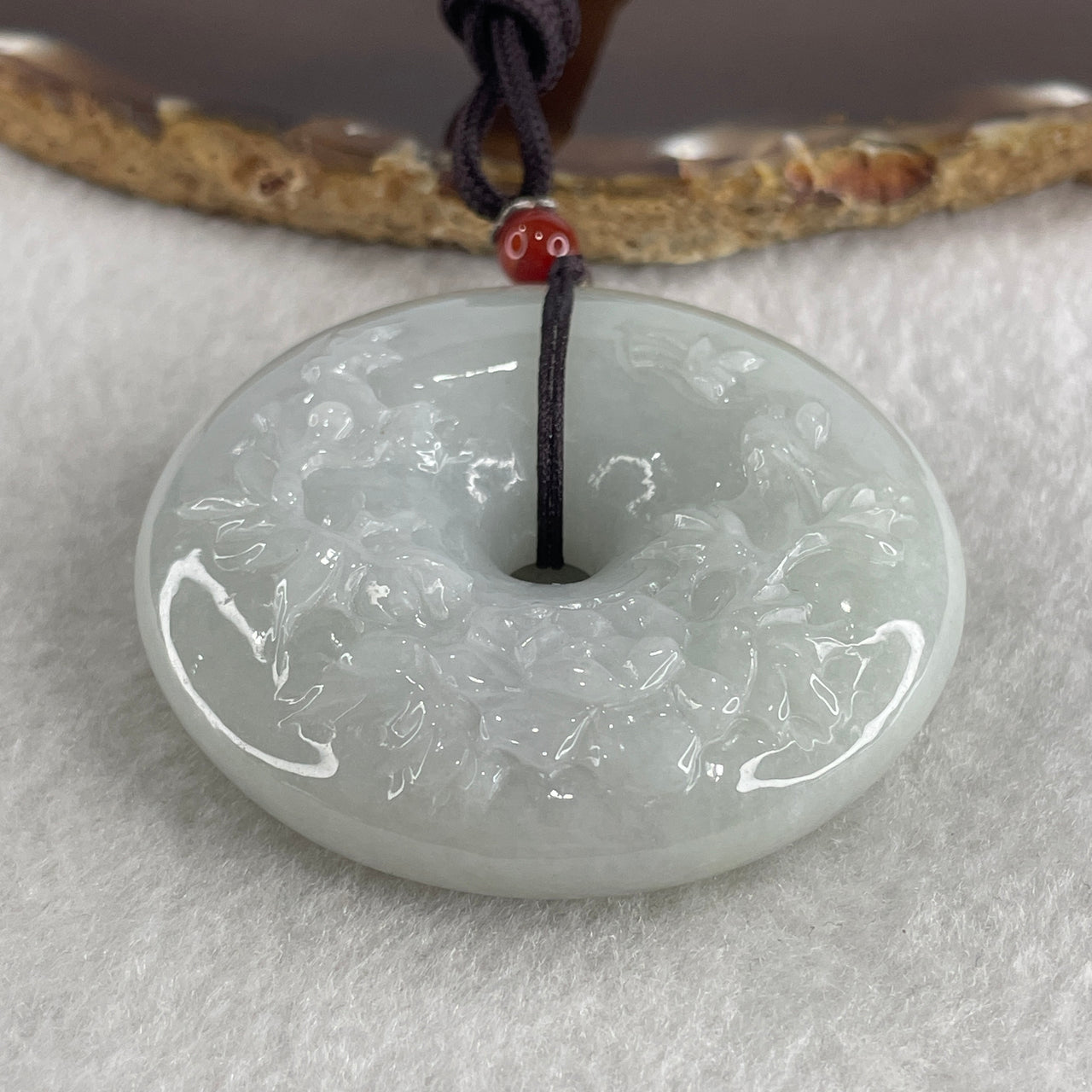 Natural Type A Faint Green Jadeite Donut with Flower Caving Pendant 86.05g 54.5 by 15.0mm - Huangs Jadeite and Jewelry Pte Ltd