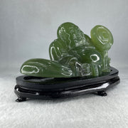 Natural Green Serpentine Siting Milo Buddha with Coin with Wooden Stand Display 1014.8g 200.0 by 100.0 by 105.0mm - Huangs Jadeite and Jewelry Pte Ltd